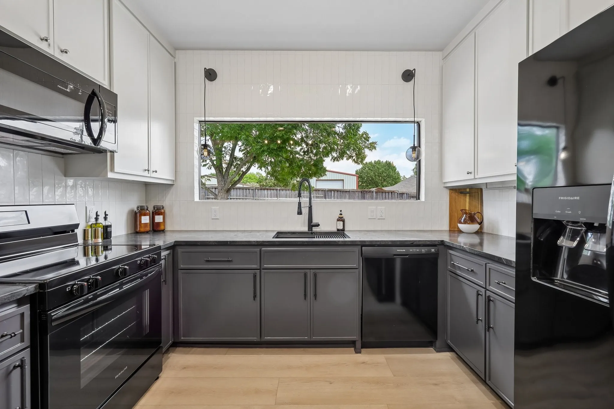 Guest House is fully self contained with a thoughtfully designed full kitchen featuring a lovely picture window above the sink letting in lots of natural light.