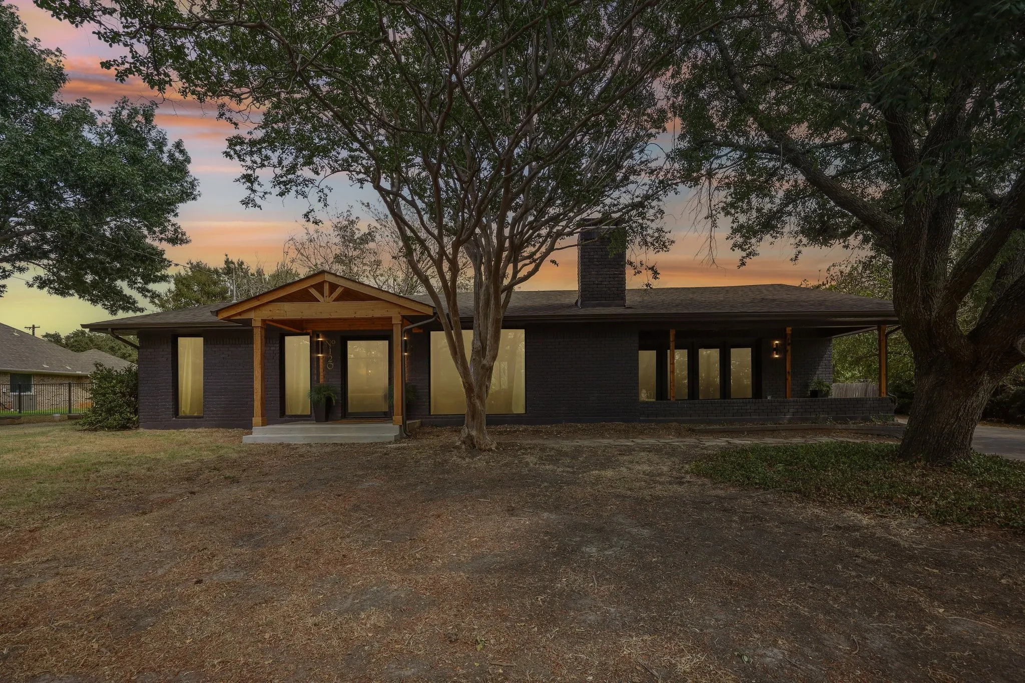 Single story lake house with lots of windows and large covered porches to sit & enjoy the views.
