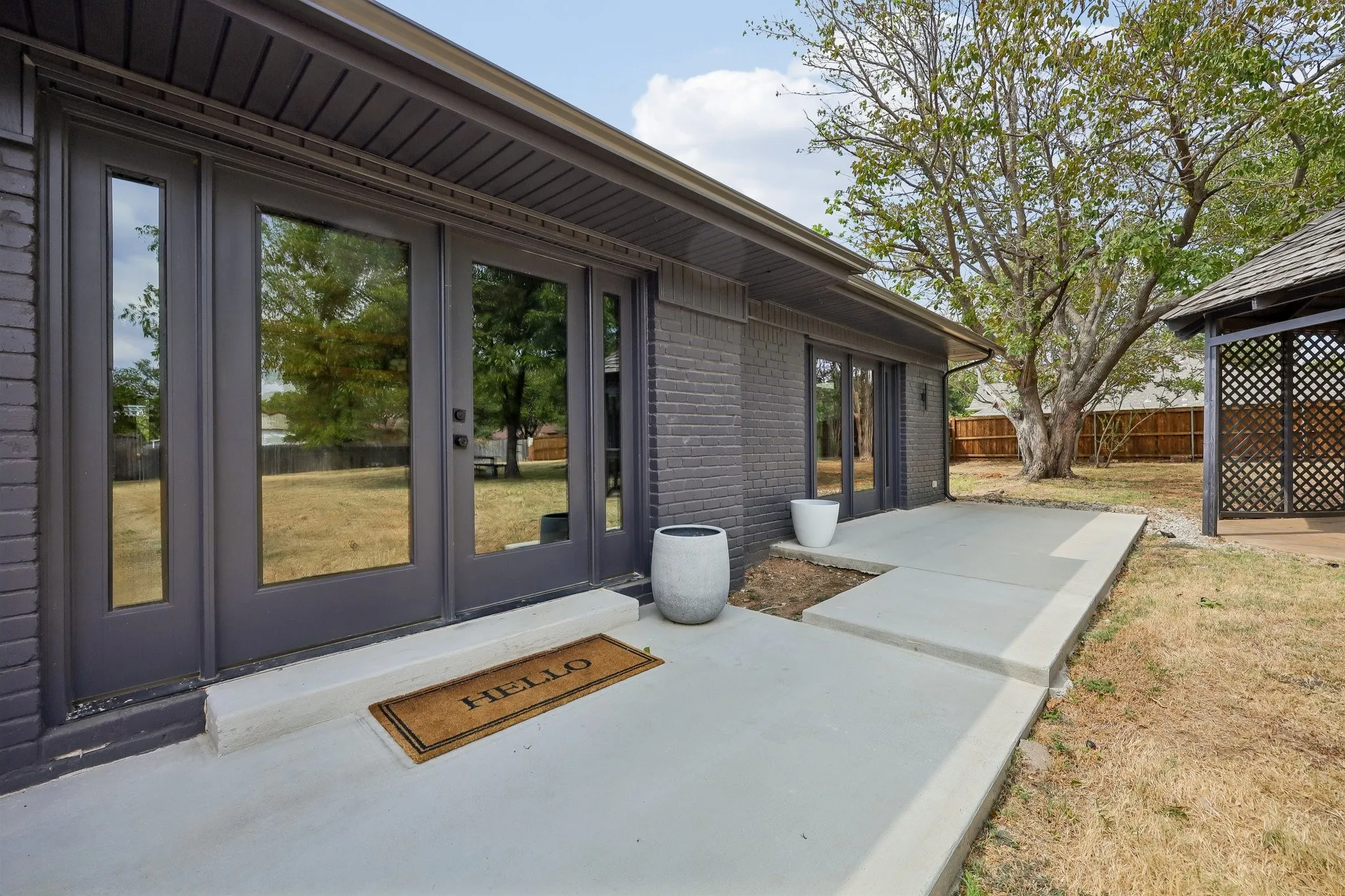 Back patio is spacious enough to accomodate outdoor seating here as well.