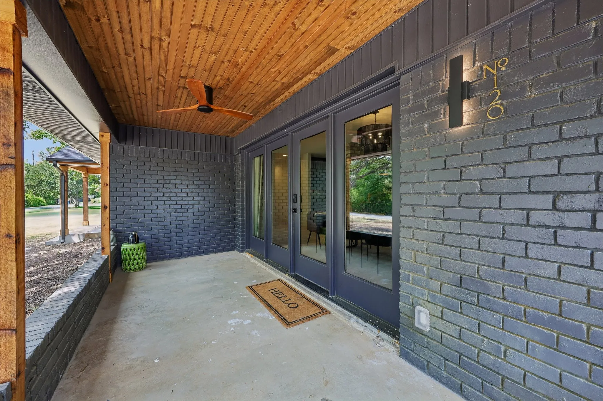 Large covered patio is perfect for relaxing & watching the boats & the birds on the lake.
