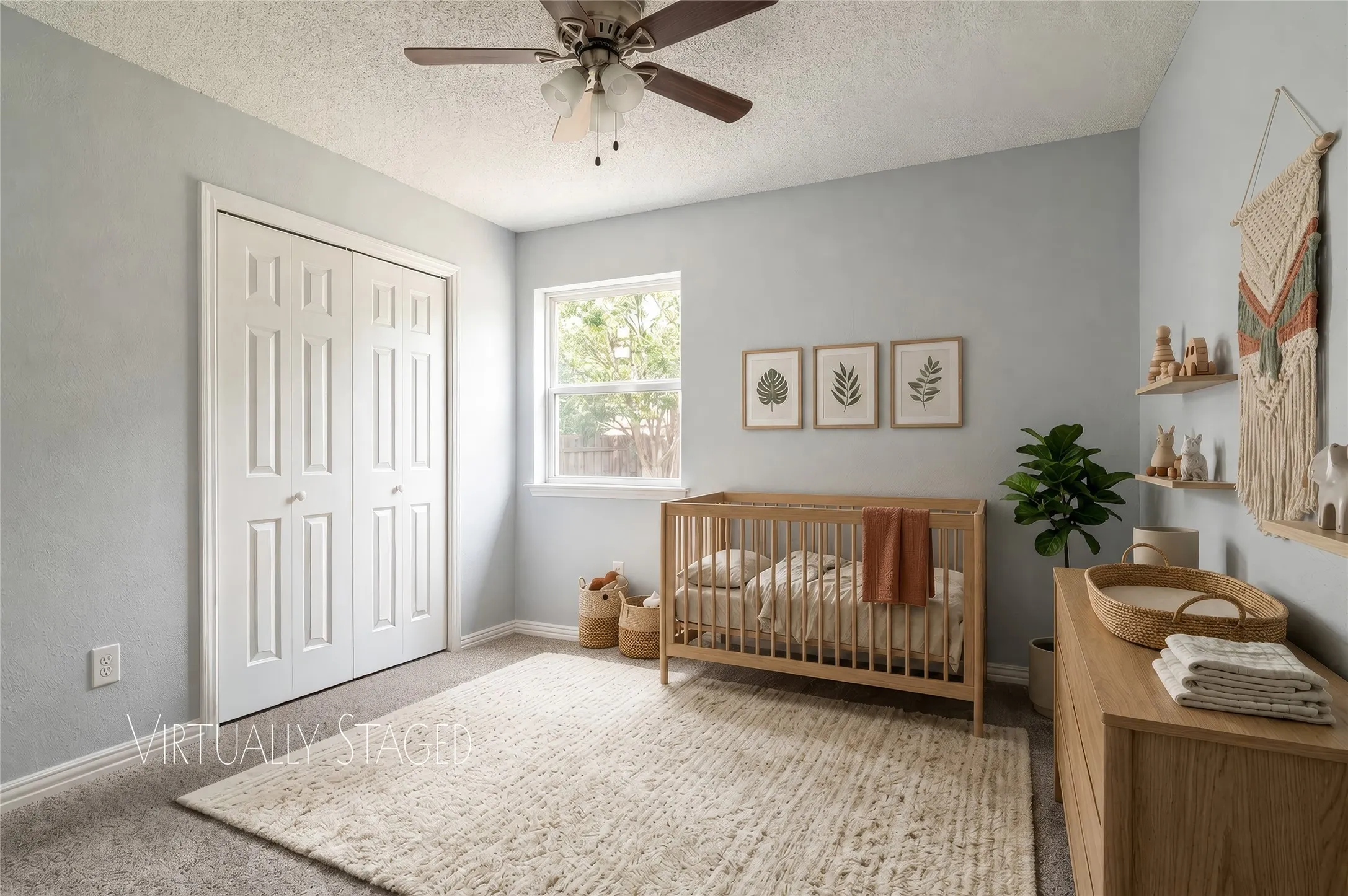 Ceiling fan with light kit, double door closet doors, window with sideyard exposure, light gray wall paint, and gray carpet flooring
