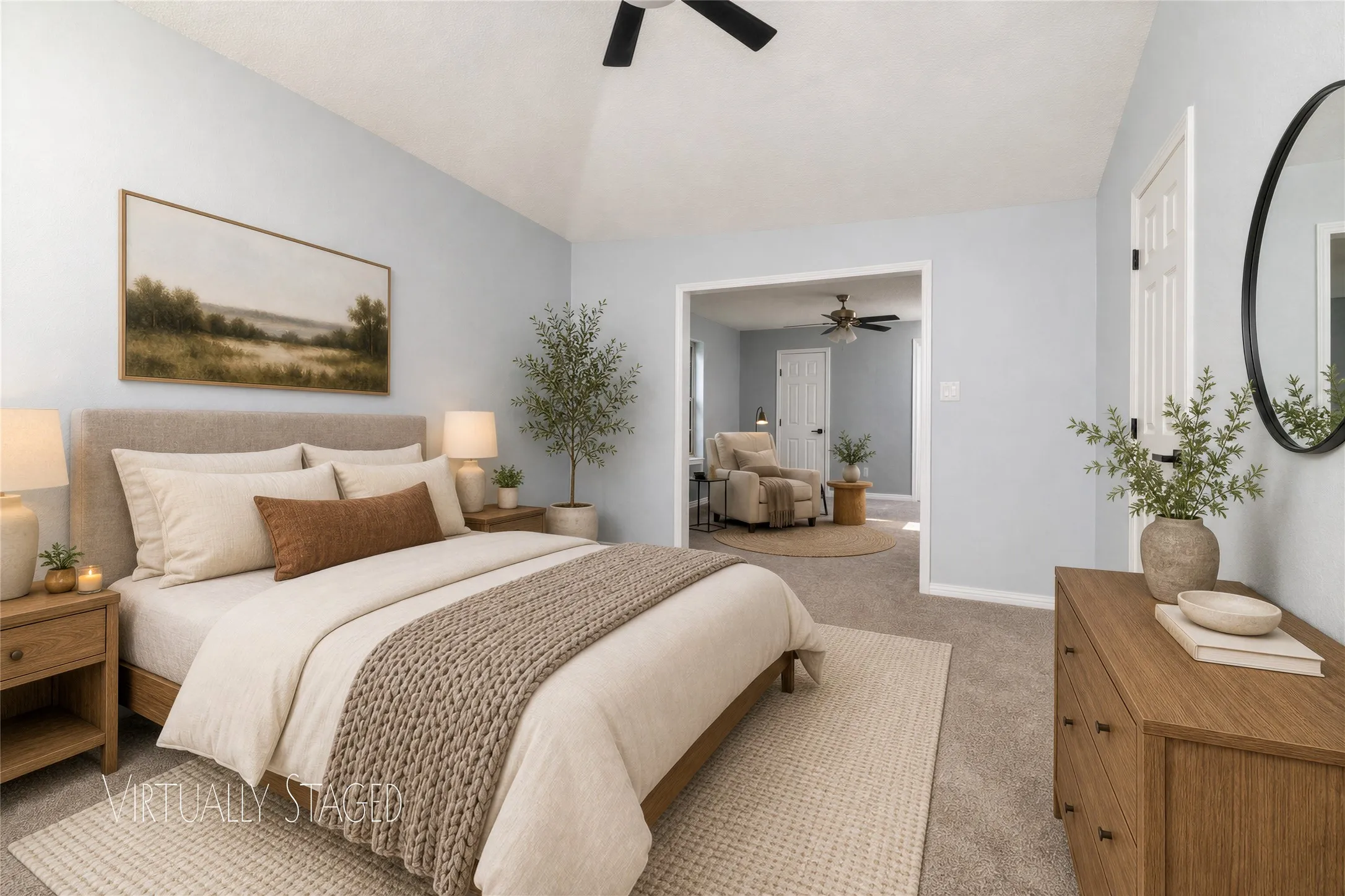 Vaulted ceiling with ceiling fan, carpeted flooring, and a wide entryway