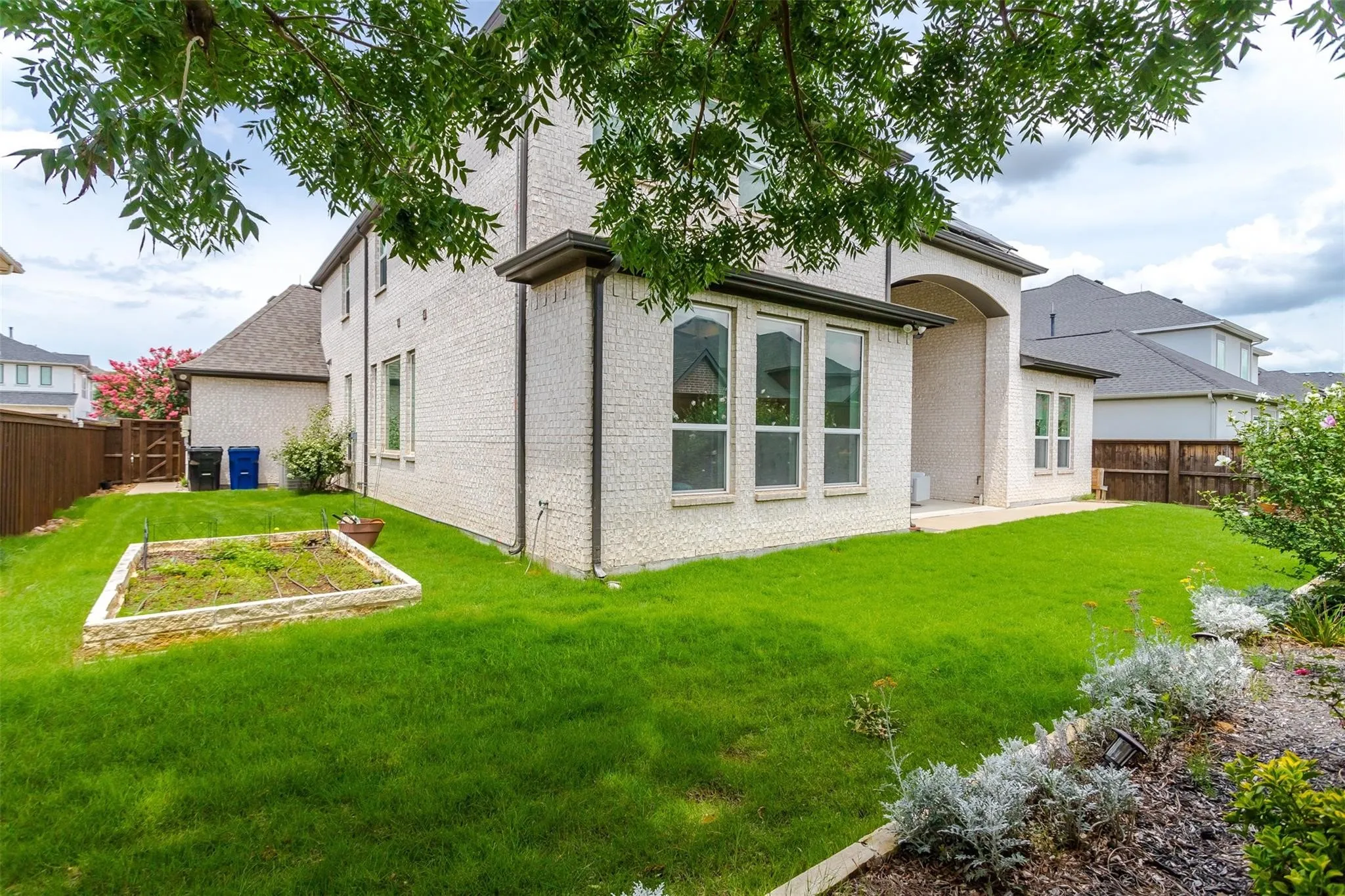 White brick exterior with dark trim accents