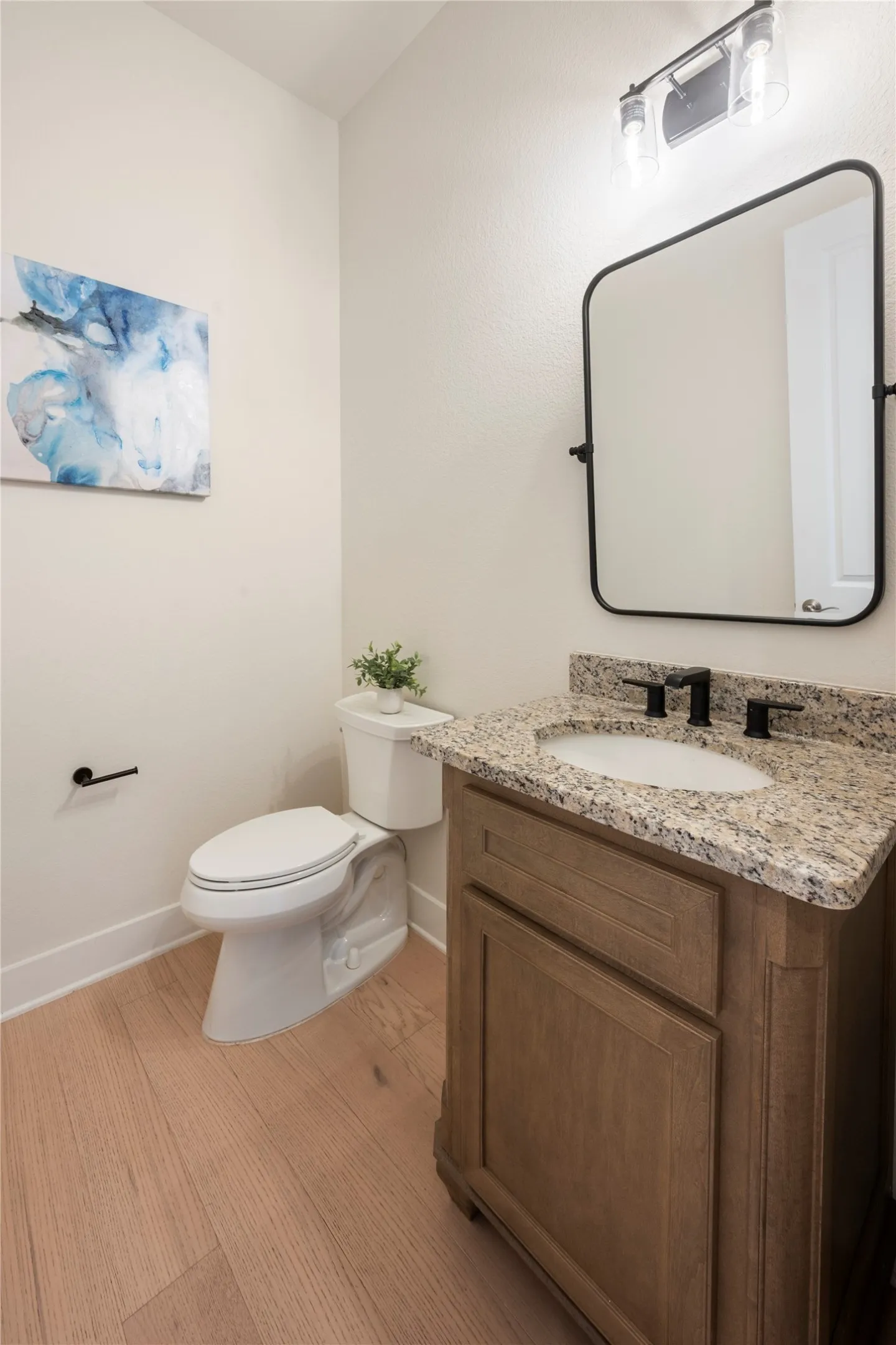 Powder room at side entrance from garage.