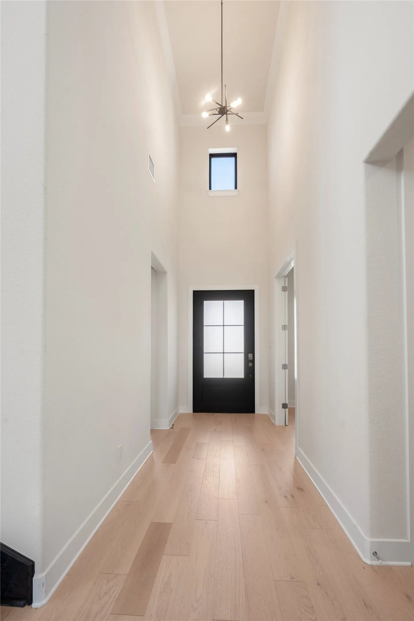 Foyer. To the right garage. To the left stairs.