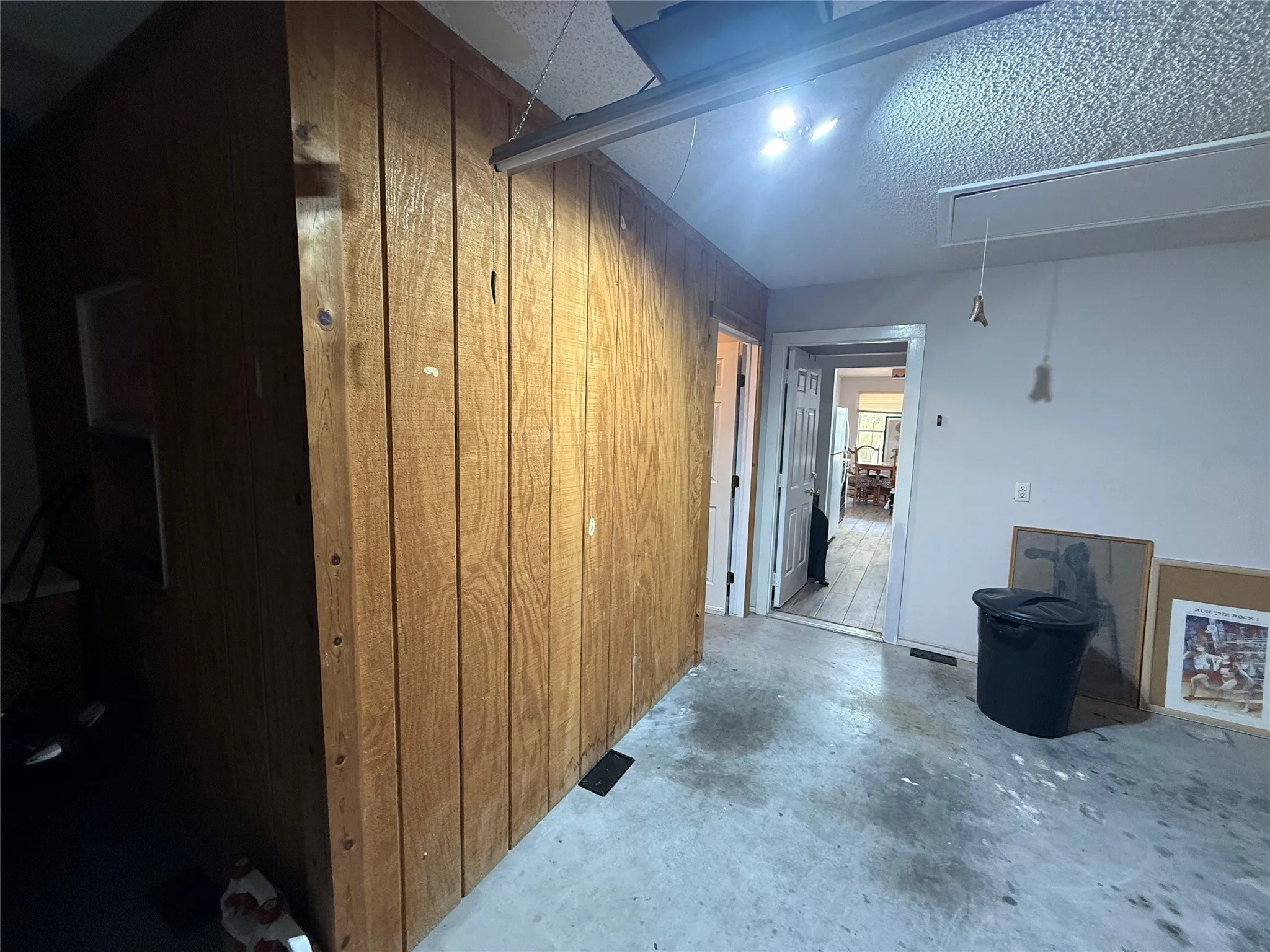Double car garage;
Portable wall divided for storage and workshop area.