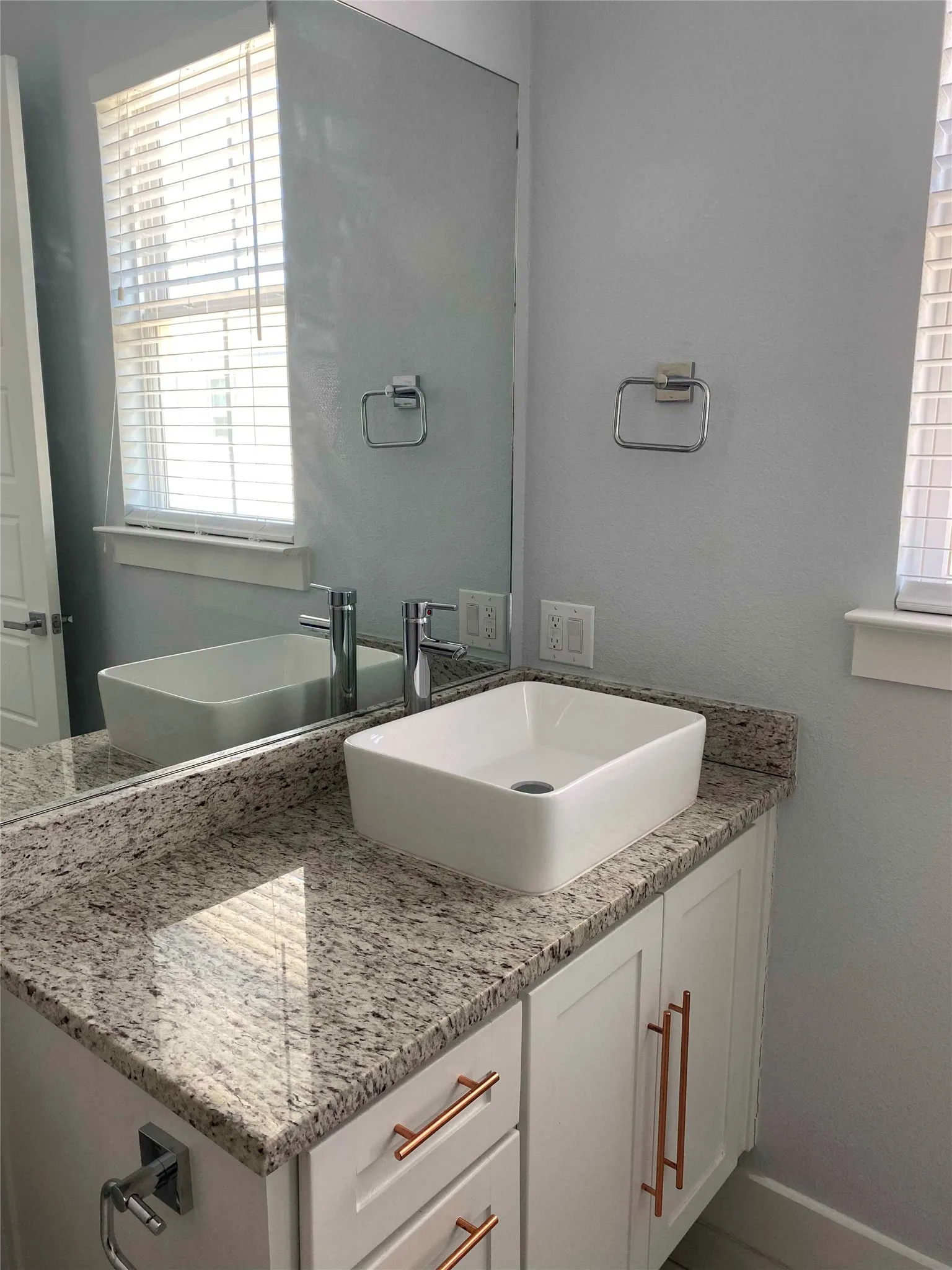 Bathroom with vanity and baseboards