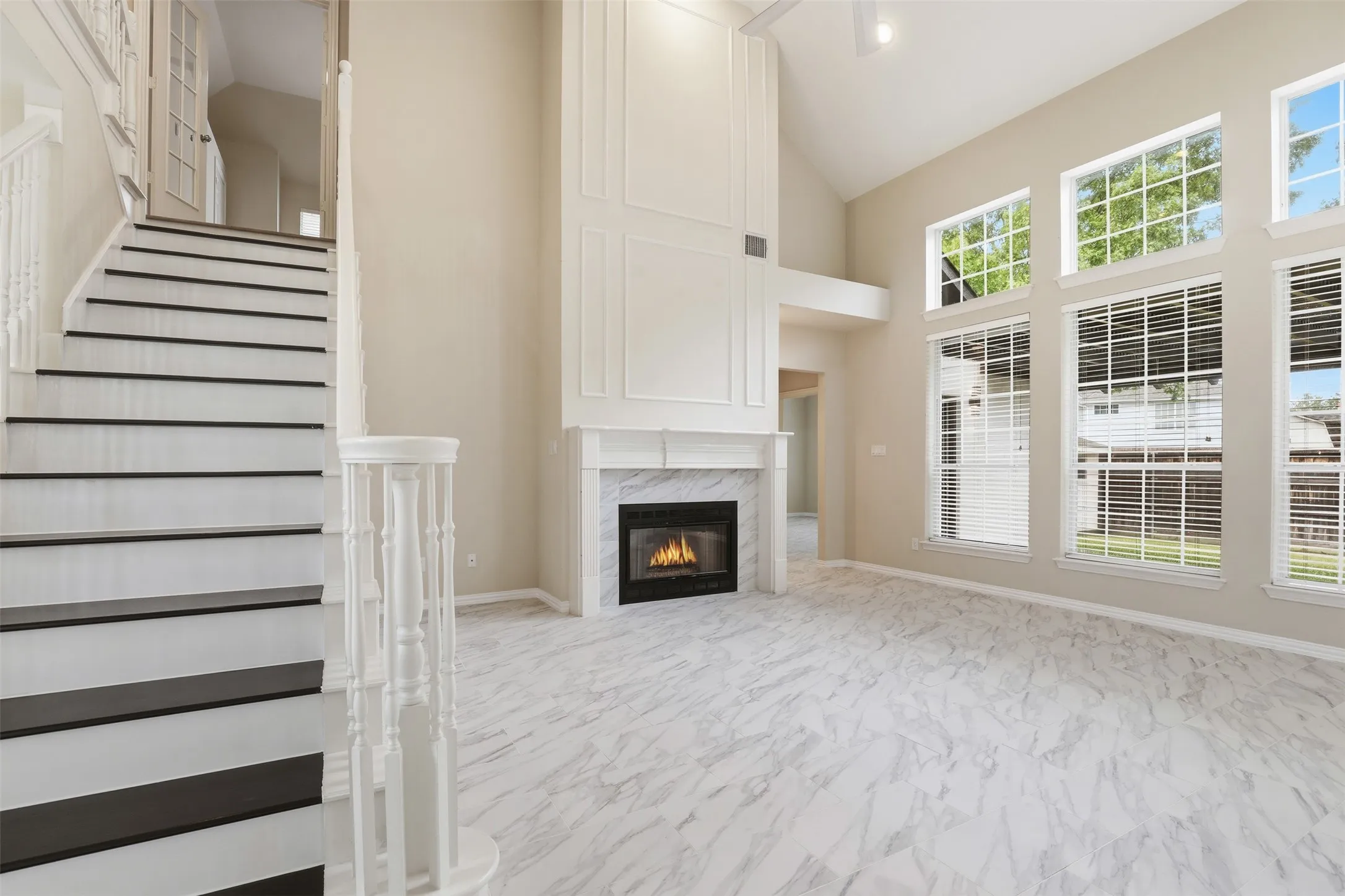 Living Room with a fireplace and large windows