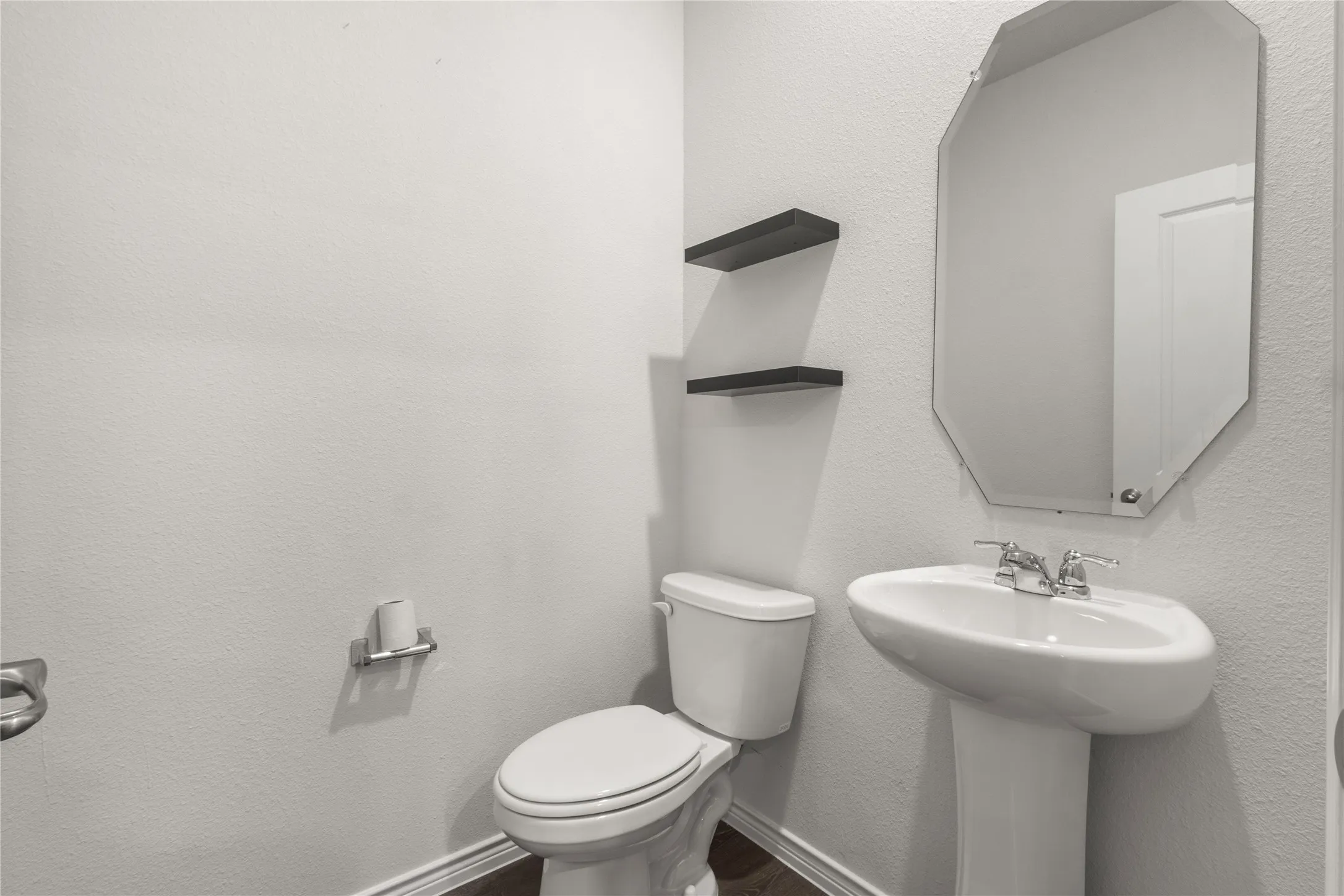 Bathroom with toilet and wood finished floors