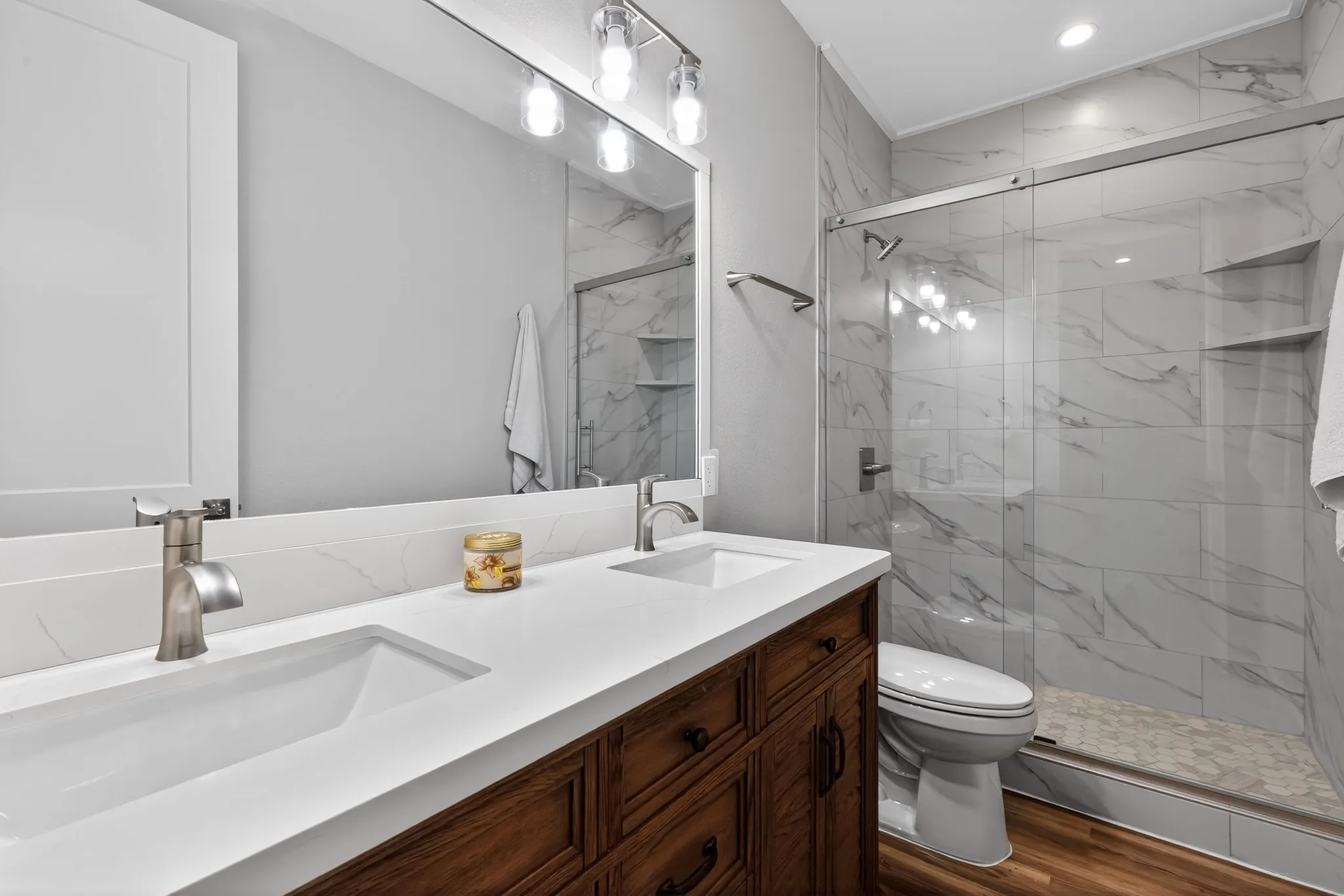 Dual vanity with integrated sinks and white countertops