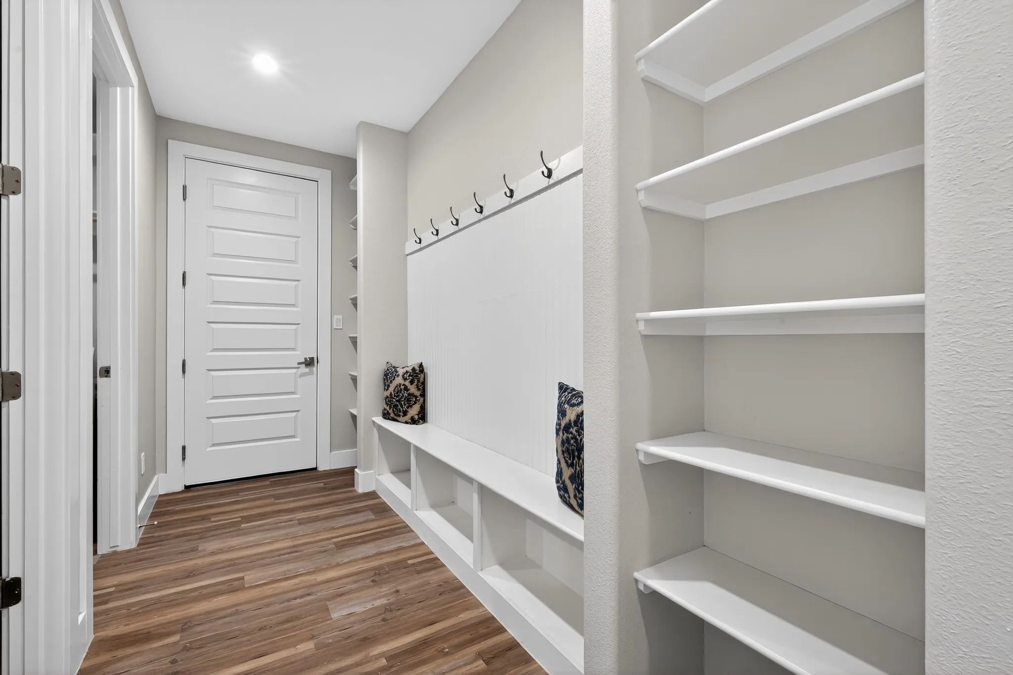 Wood-finish flooring complemented by light gray walls