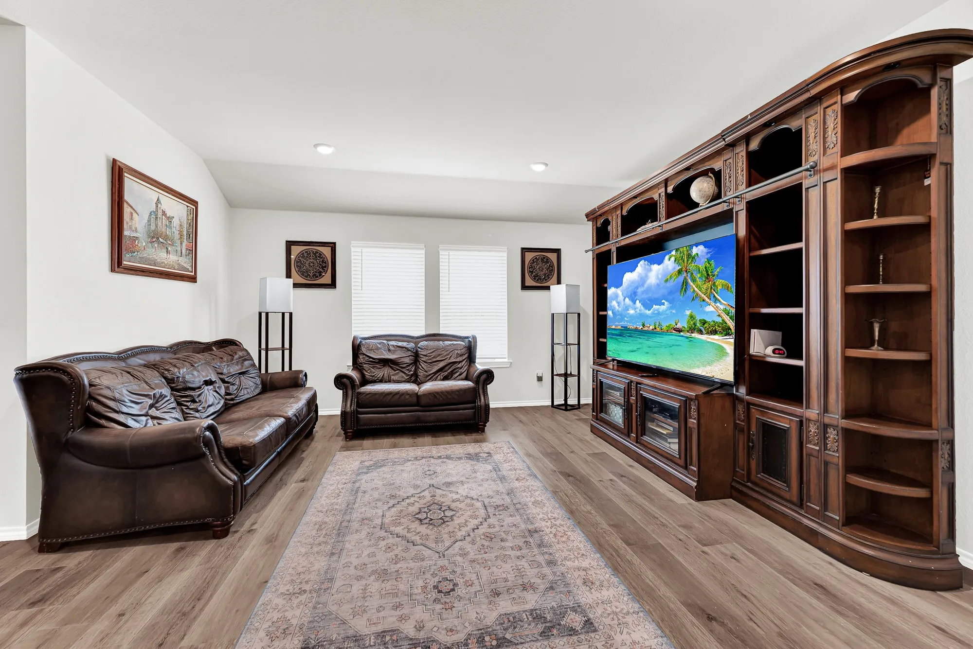 Natural light filters through twin back windows into this flexible living layout, complemented by subtle architectural ceiling angles and clean light walls. You will love relaxing in this comfortable, light-filled hub after a busy week.