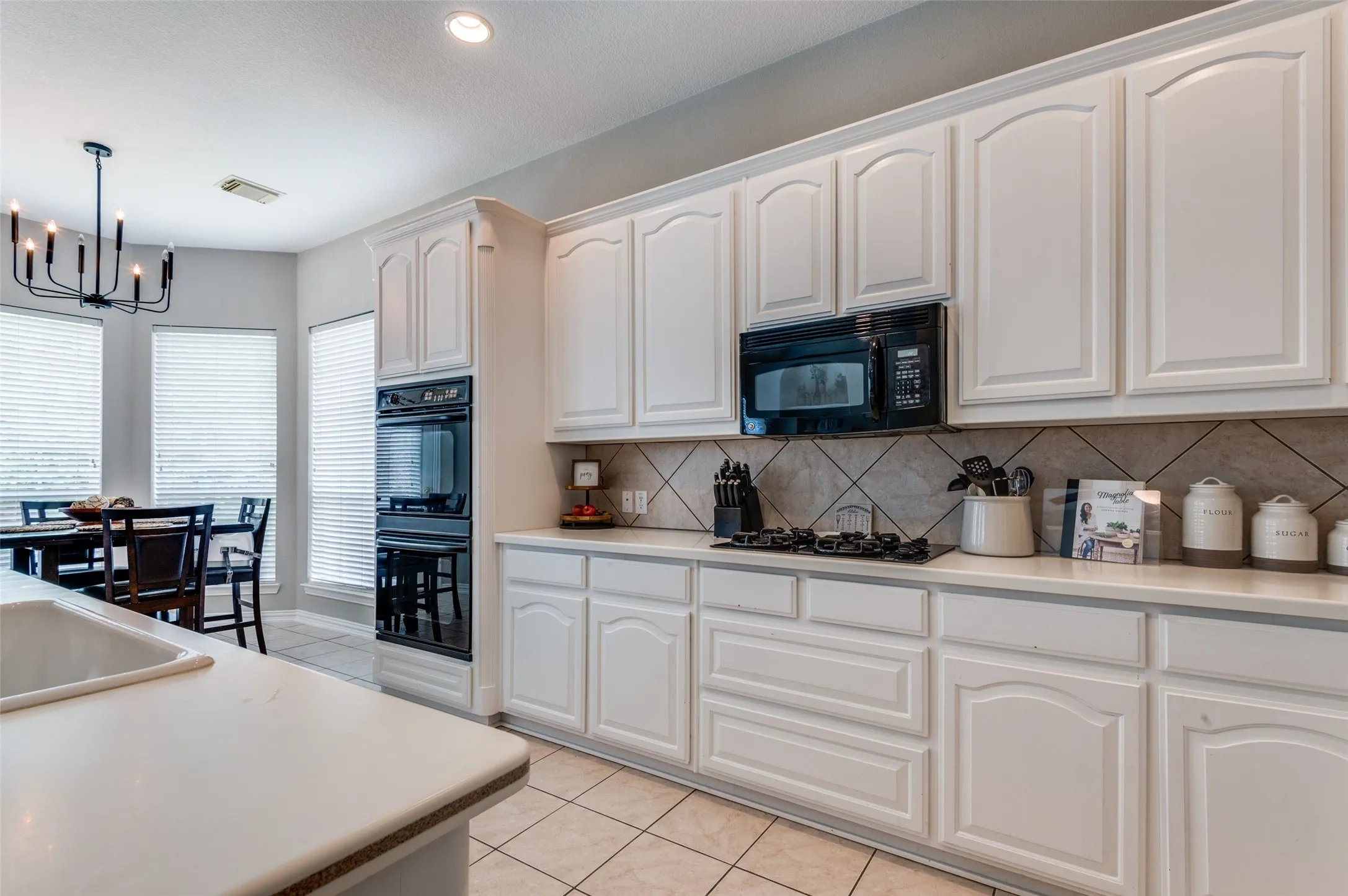 Kitchen has so much counter space and so many cabinets