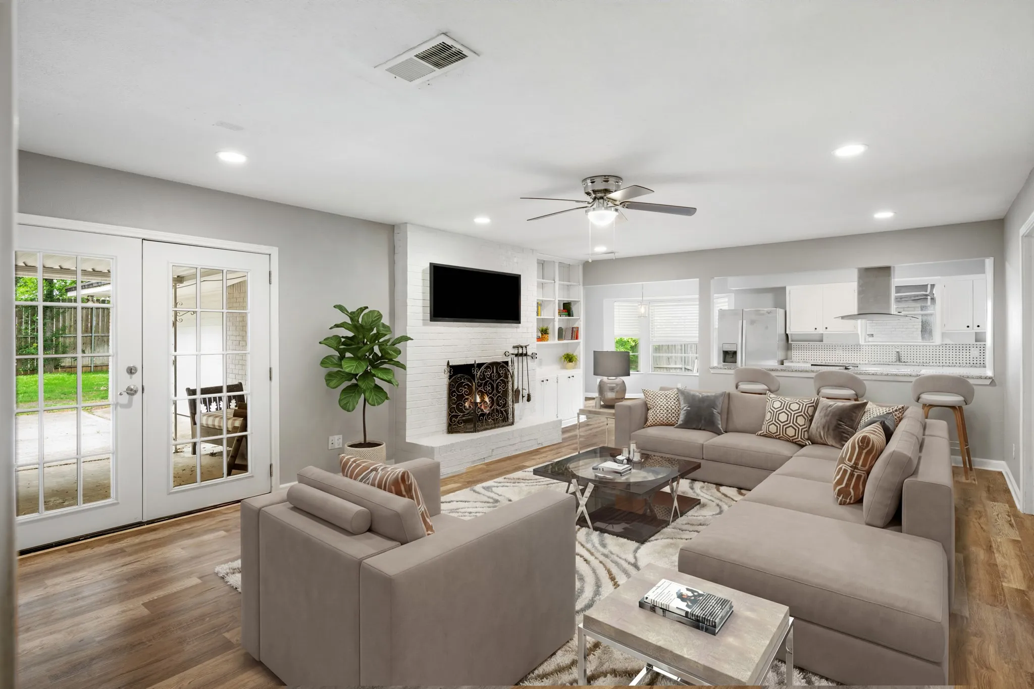Spacious main living room with sightlines into the kitchen.