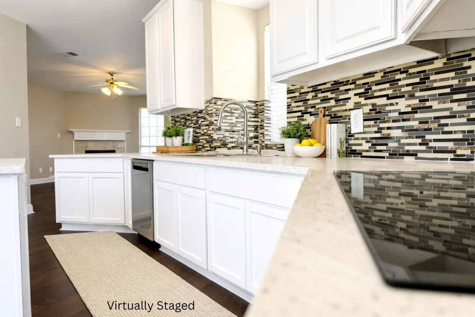 Kitchen featuring white cabinetry, light-toned countertops, a mosaic tile backsplash, and dark wood-finish flooring