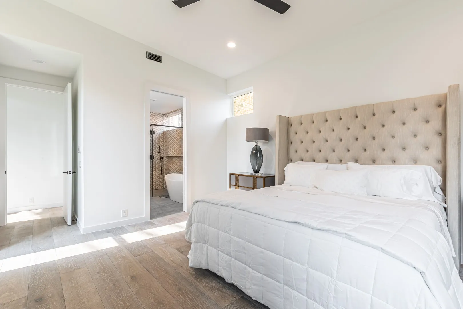 Bedroom featuring hardwood / wood-style flooring, recessed lighting, connected bathroom, and ceiling fan