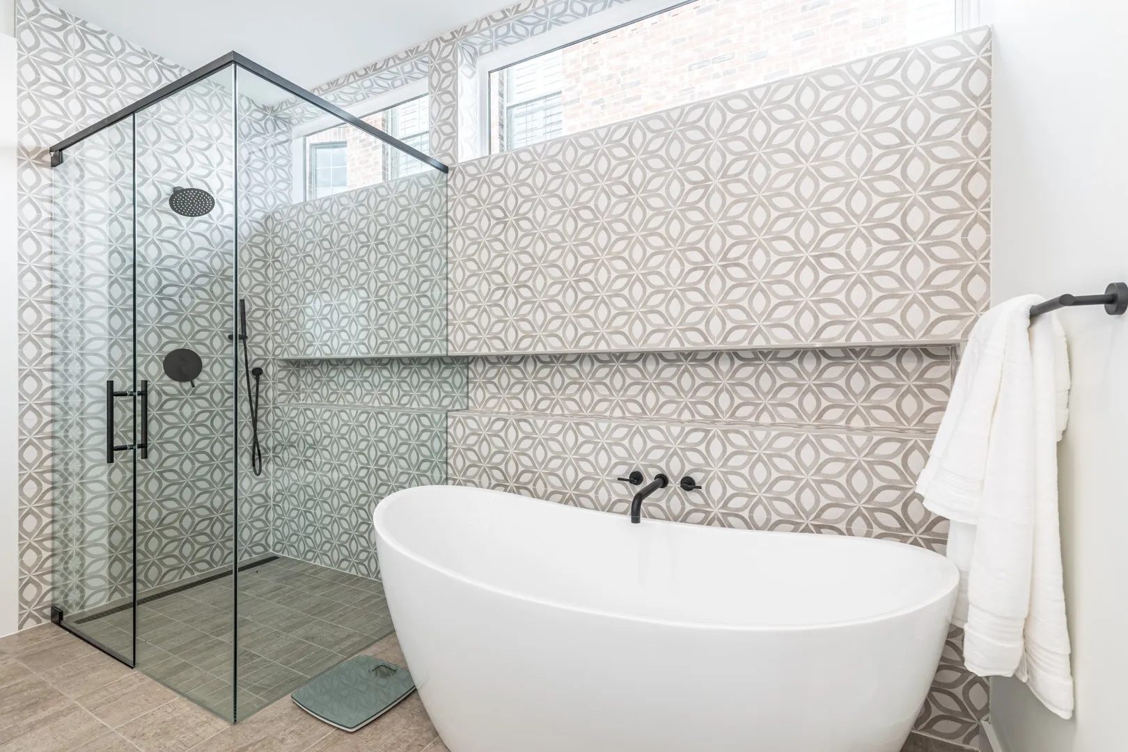 Full bath featuring a soaking tub and a shower stall