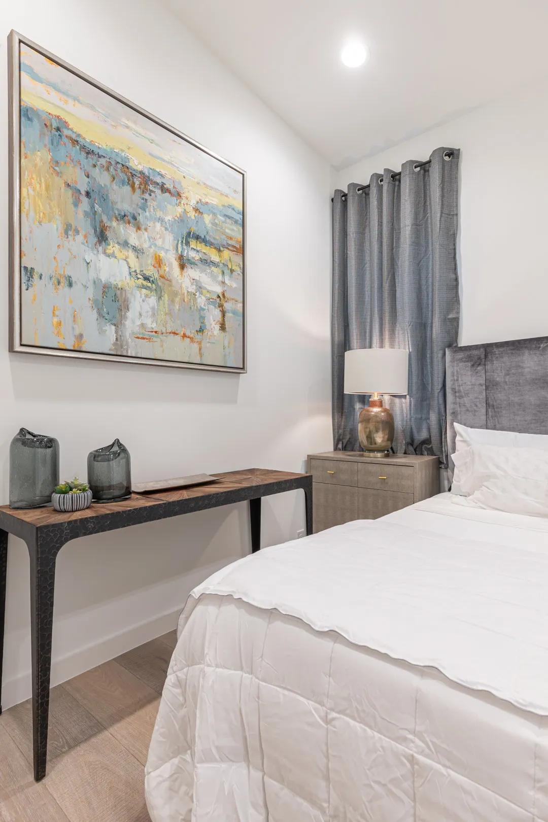 Bedroom with wood finished floors and recessed lighting