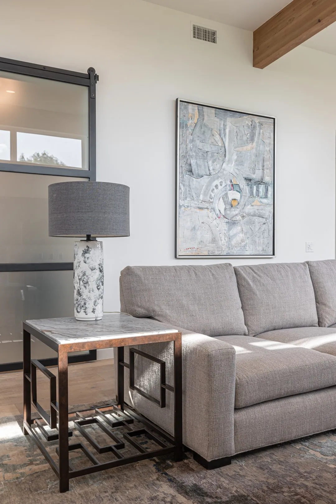 Living area featuring wood finished floors and beamed ceiling