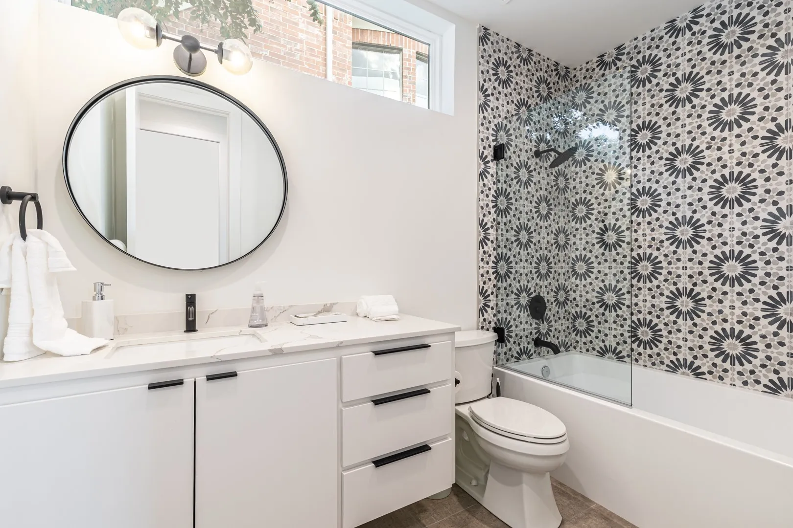 Full bathroom with vanity, bathing tub / shower combination, and tile patterned floors