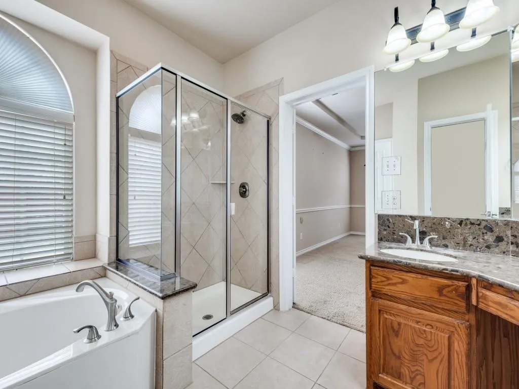 Corner soaking tub with deck-mounted faucet