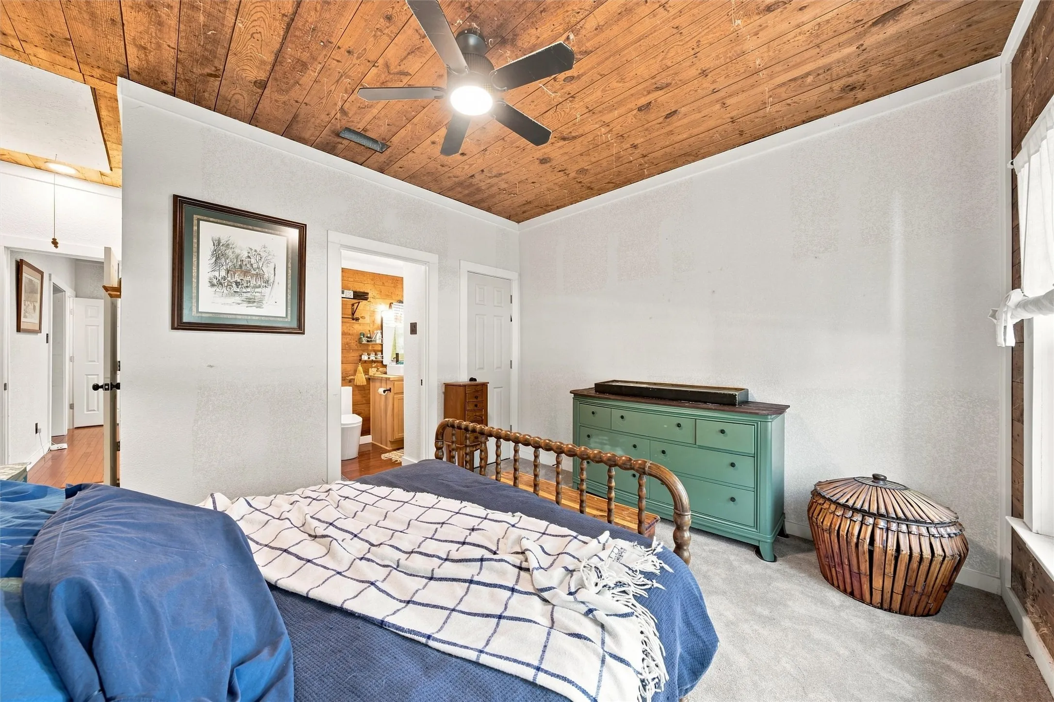 Wood-finish plank ceiling with a ceiling fan