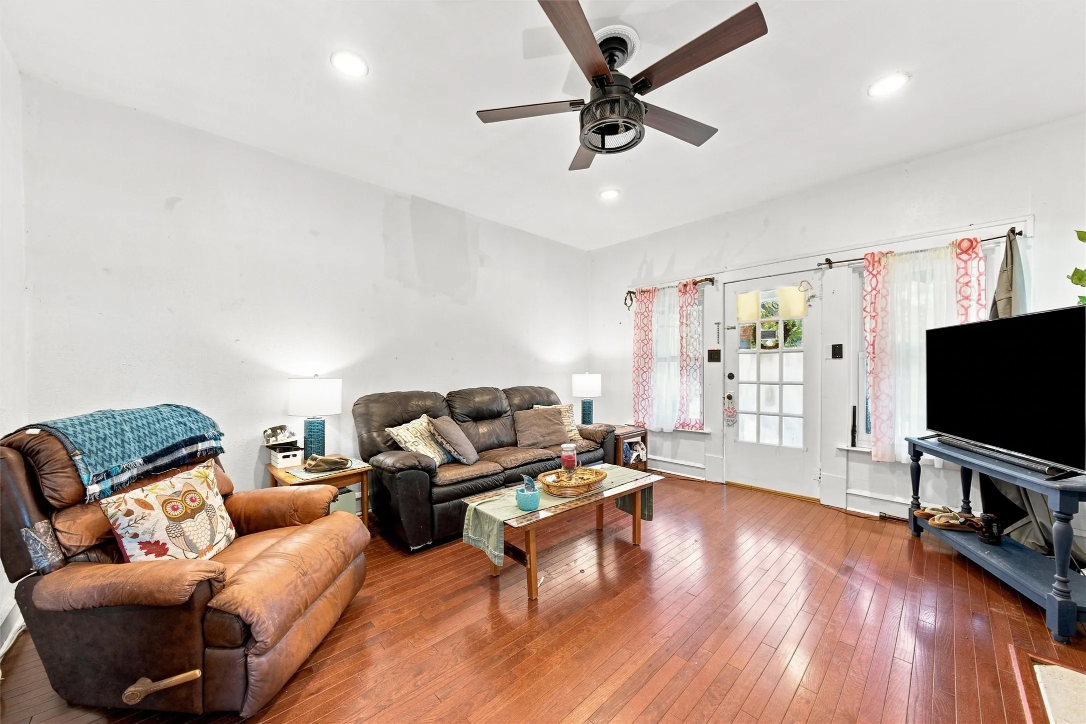 Recessed lighting, wood-finish flooring, ceiling fan, and French doors