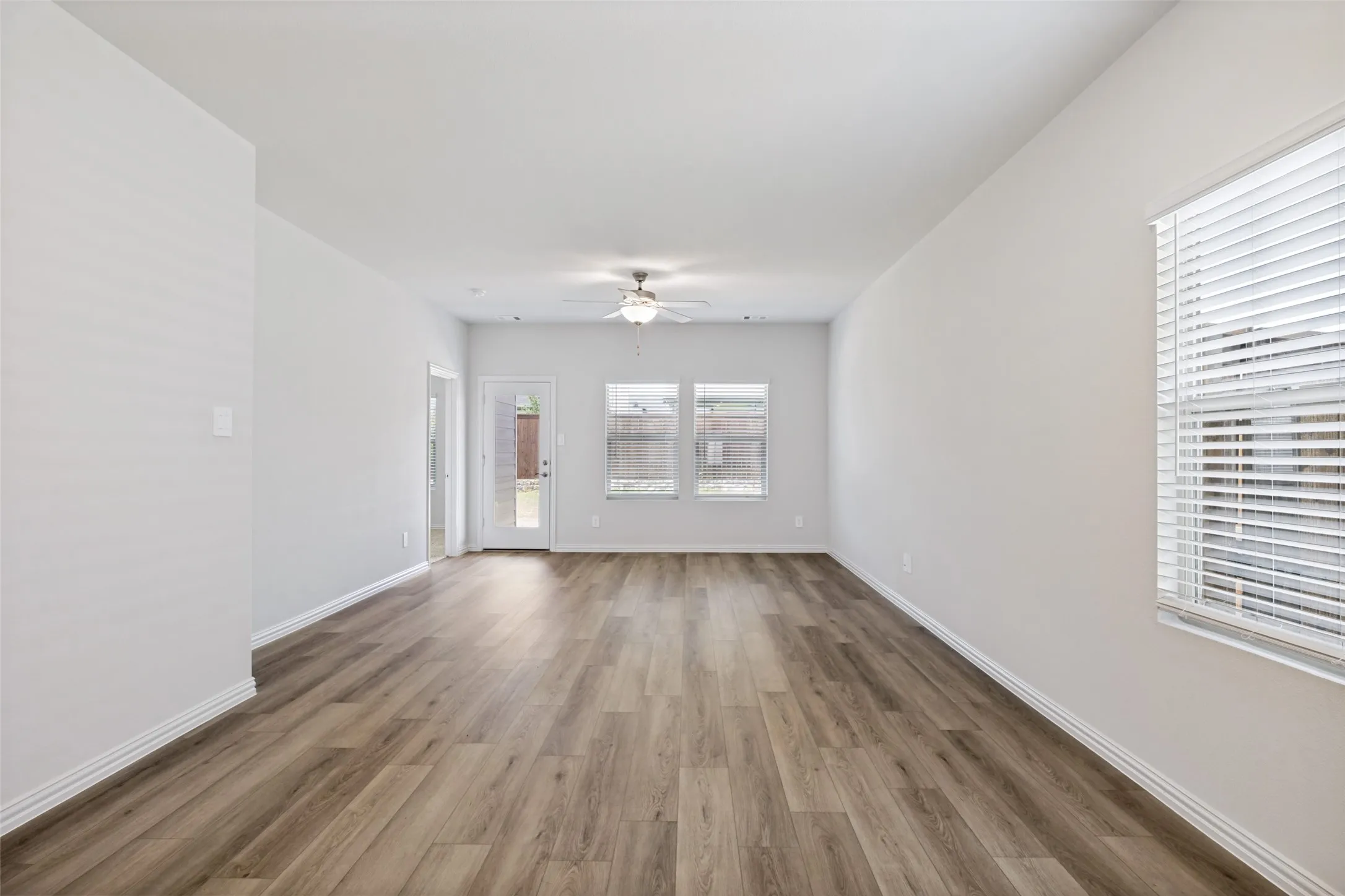 Large Open-concept living area with luxury vinyl flooring in the the high traffic areas
