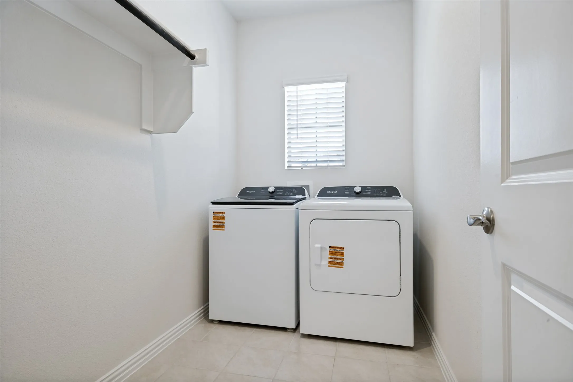 Very large separated laundry area and mud room with an adjoining closet for storage