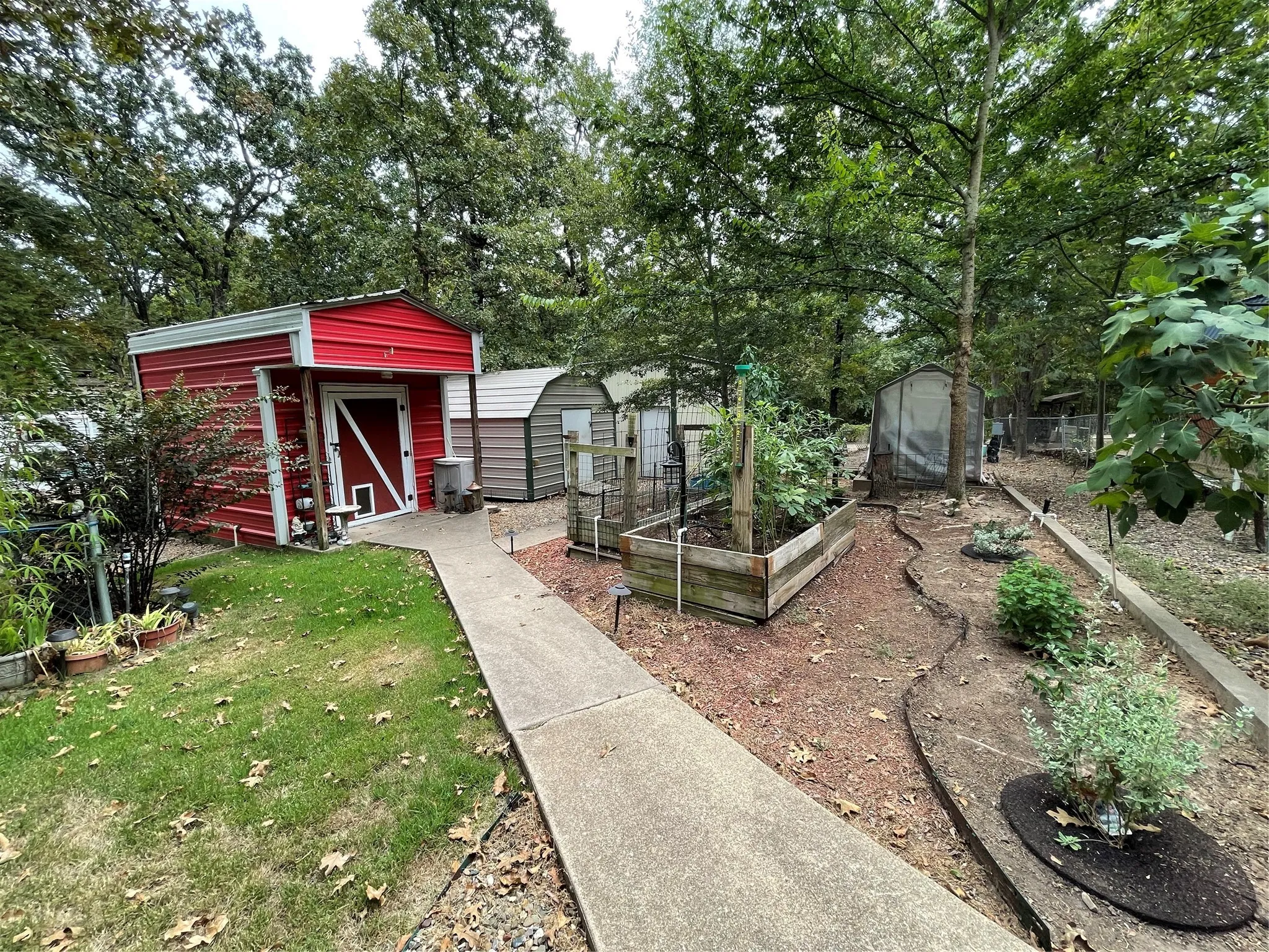 View of yard with a storage unit