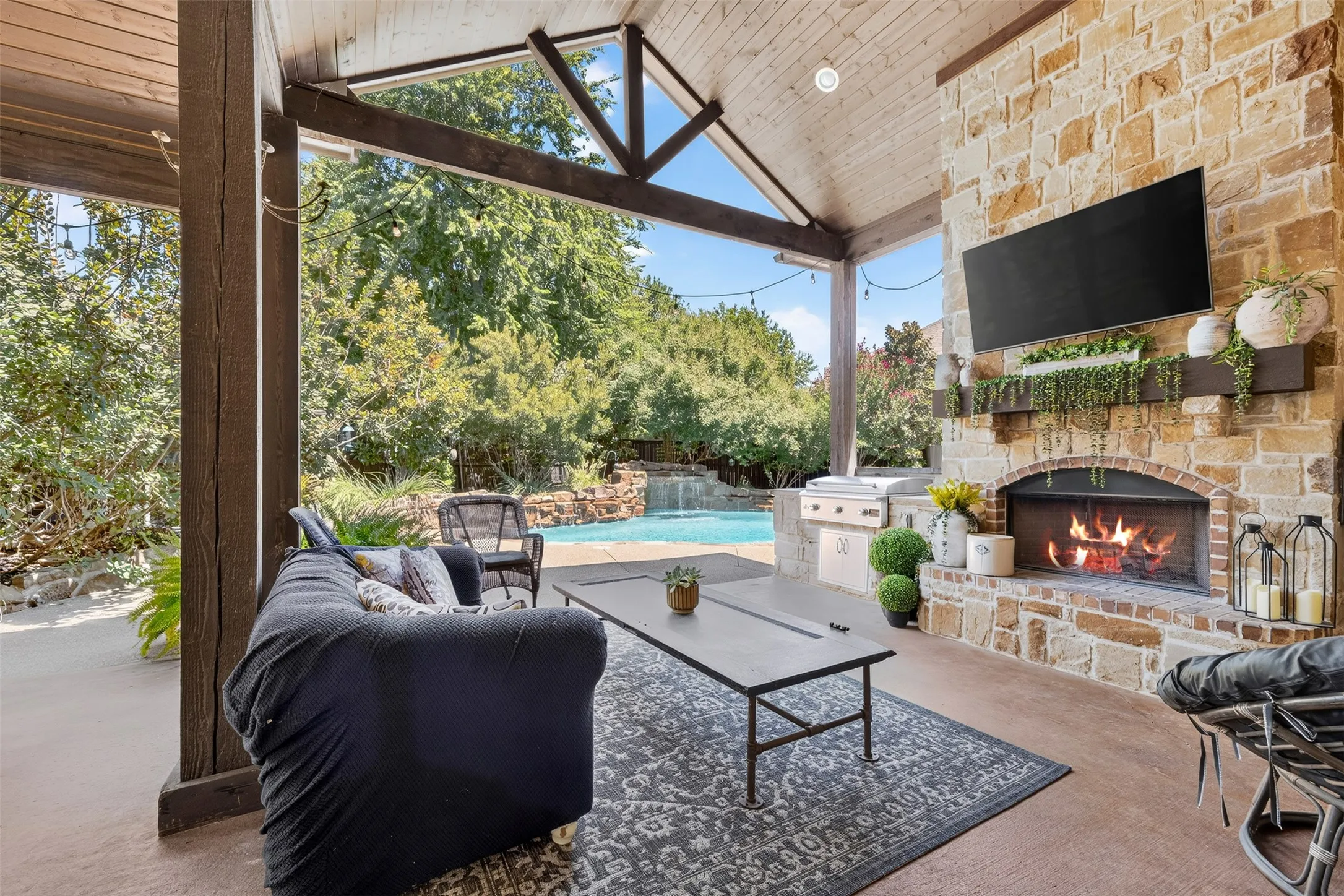 Outdoor entertainment area with wood burning fireplace