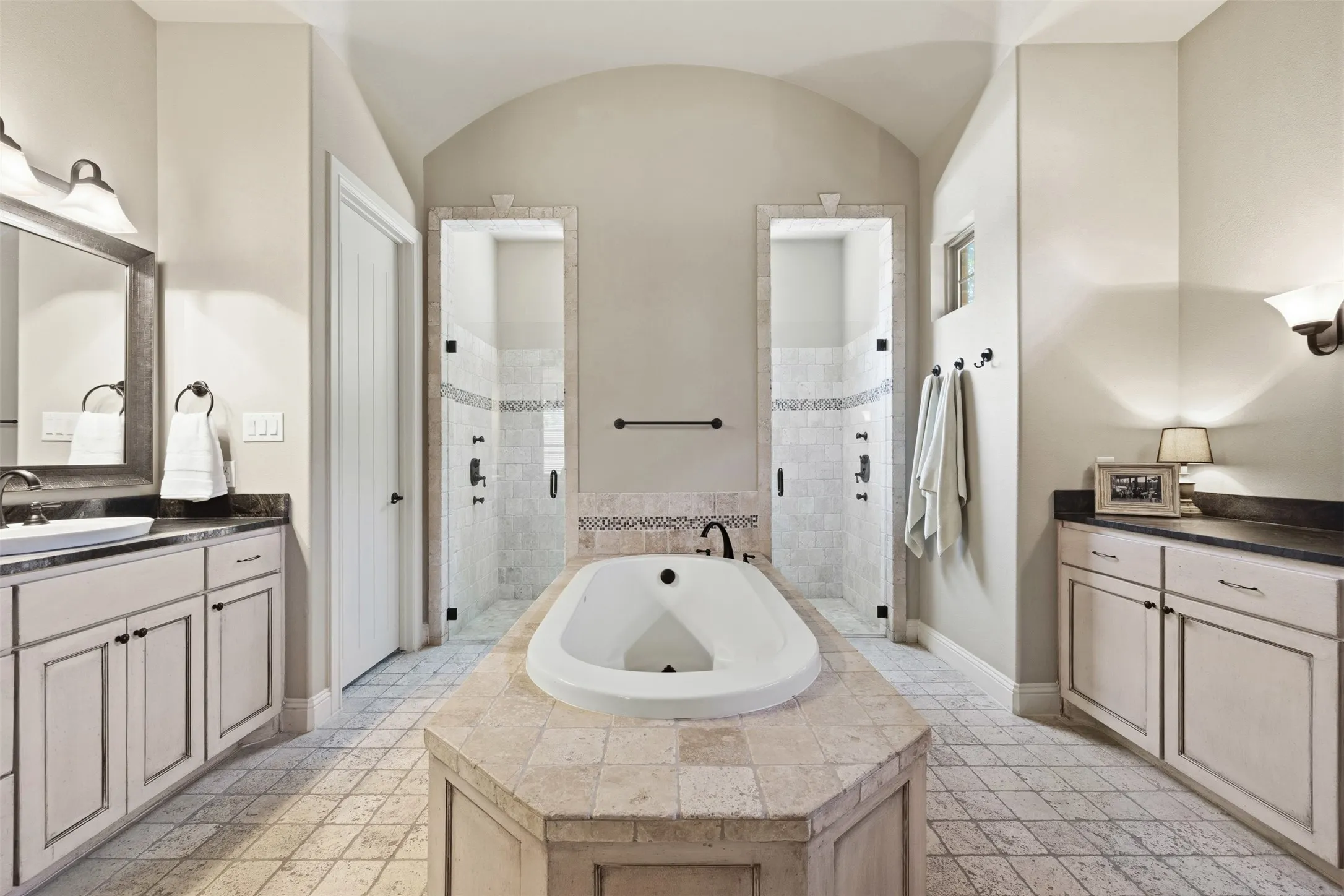 Primary bathroom with soak tub, dual sinks and double entry shower