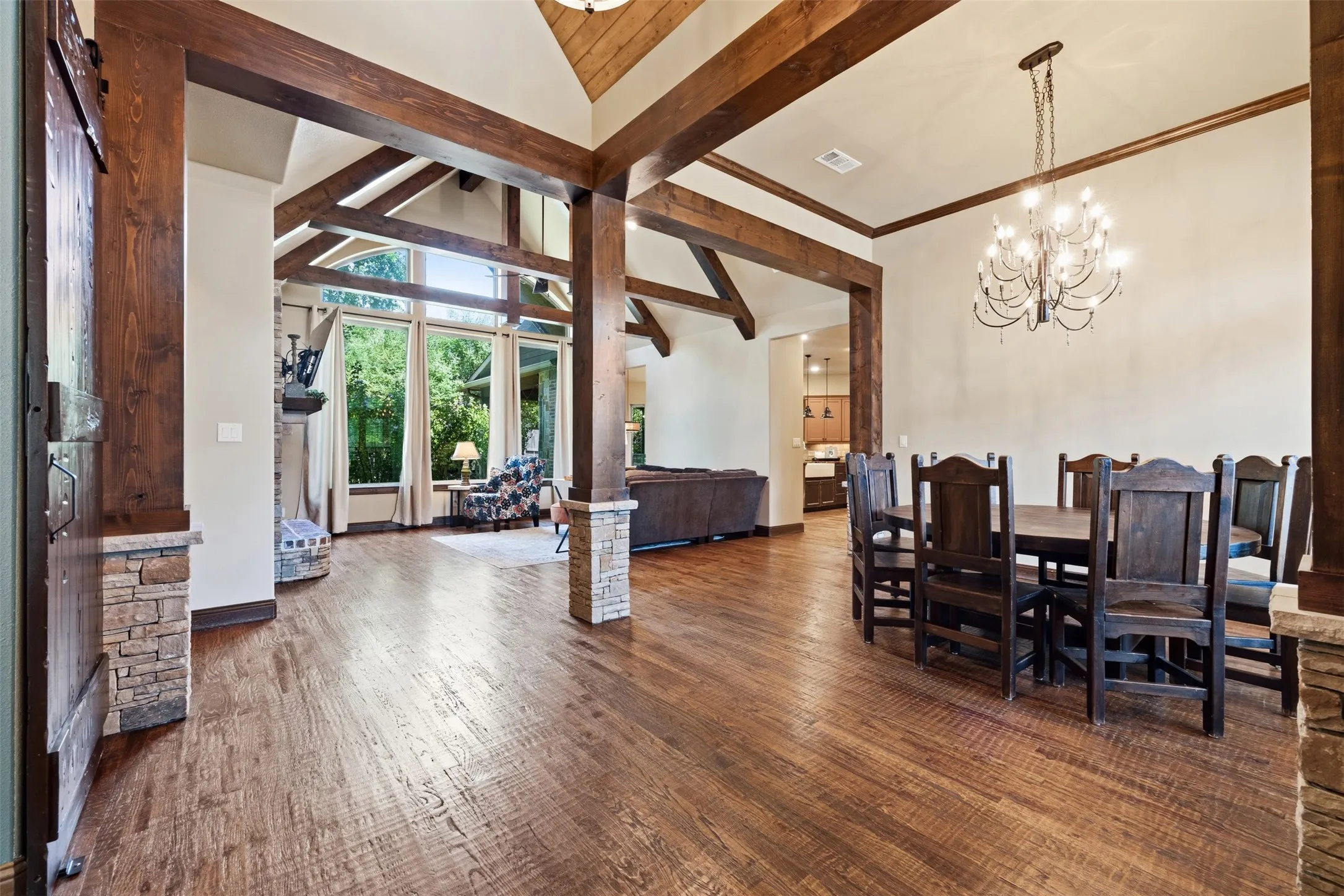 Large windows, wood floors and beams frame out this space beautifully