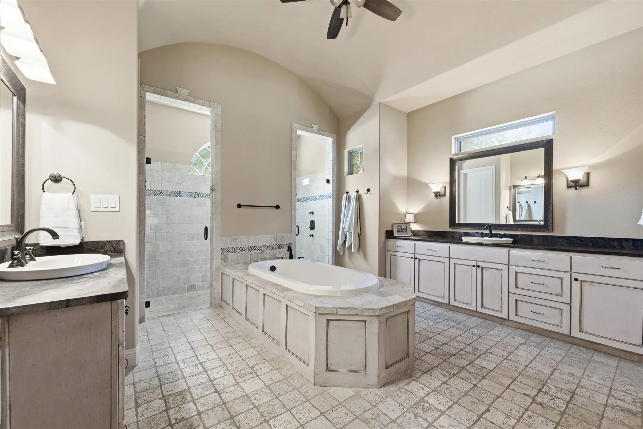 Primary bathroom with soak tub, dual sinks and double entry shower