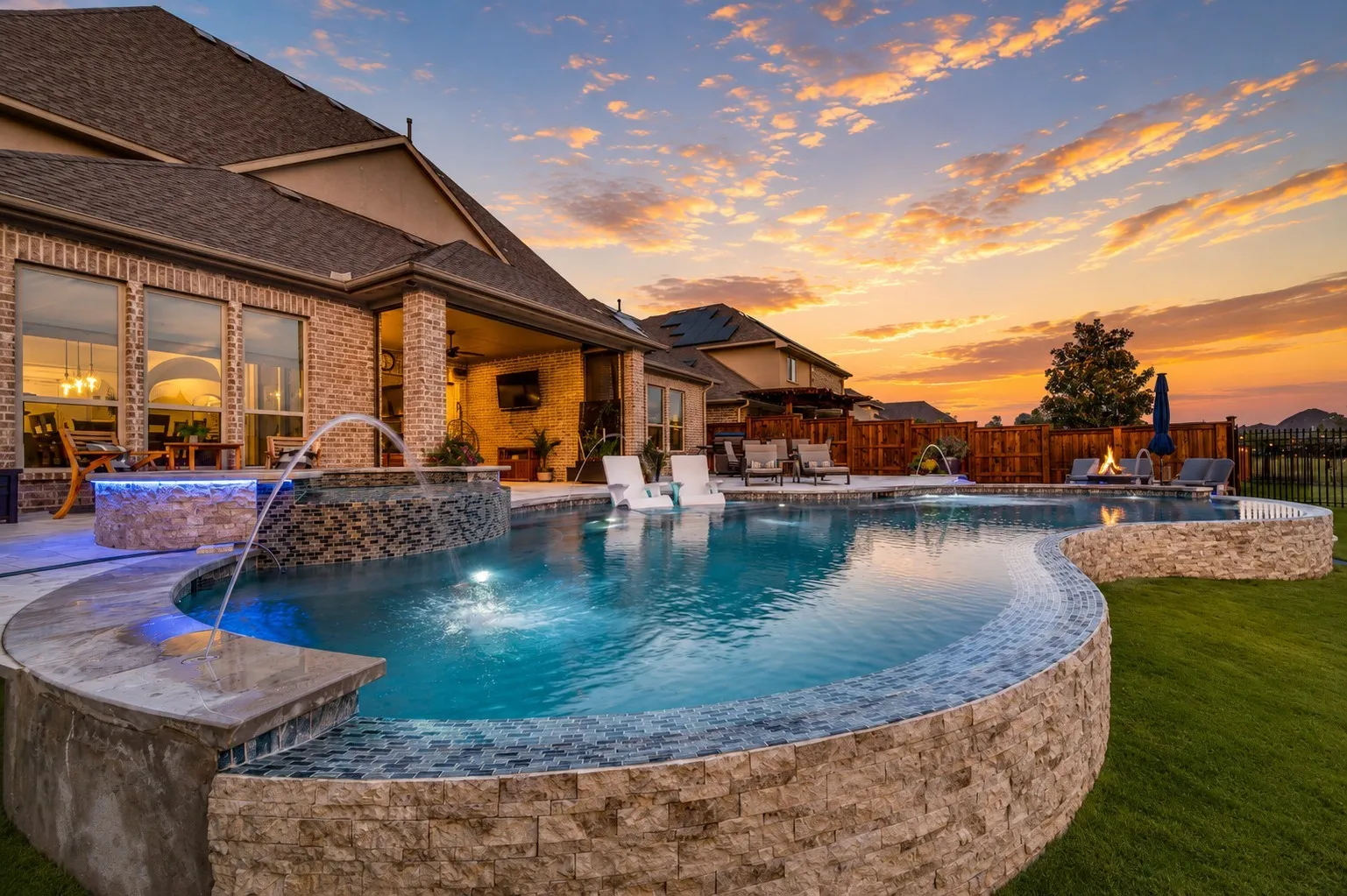 Spend your evenings or the heated pool with in-pool lounge chairs perfect for relaxing in the water. Gather around the fire pit, unwind beneath the covered patio, or simply take in the gorgeous sunset views. This is the perfect place to spend your evenings relaxing, entertaining, and enjoying outdoor living at its finest.