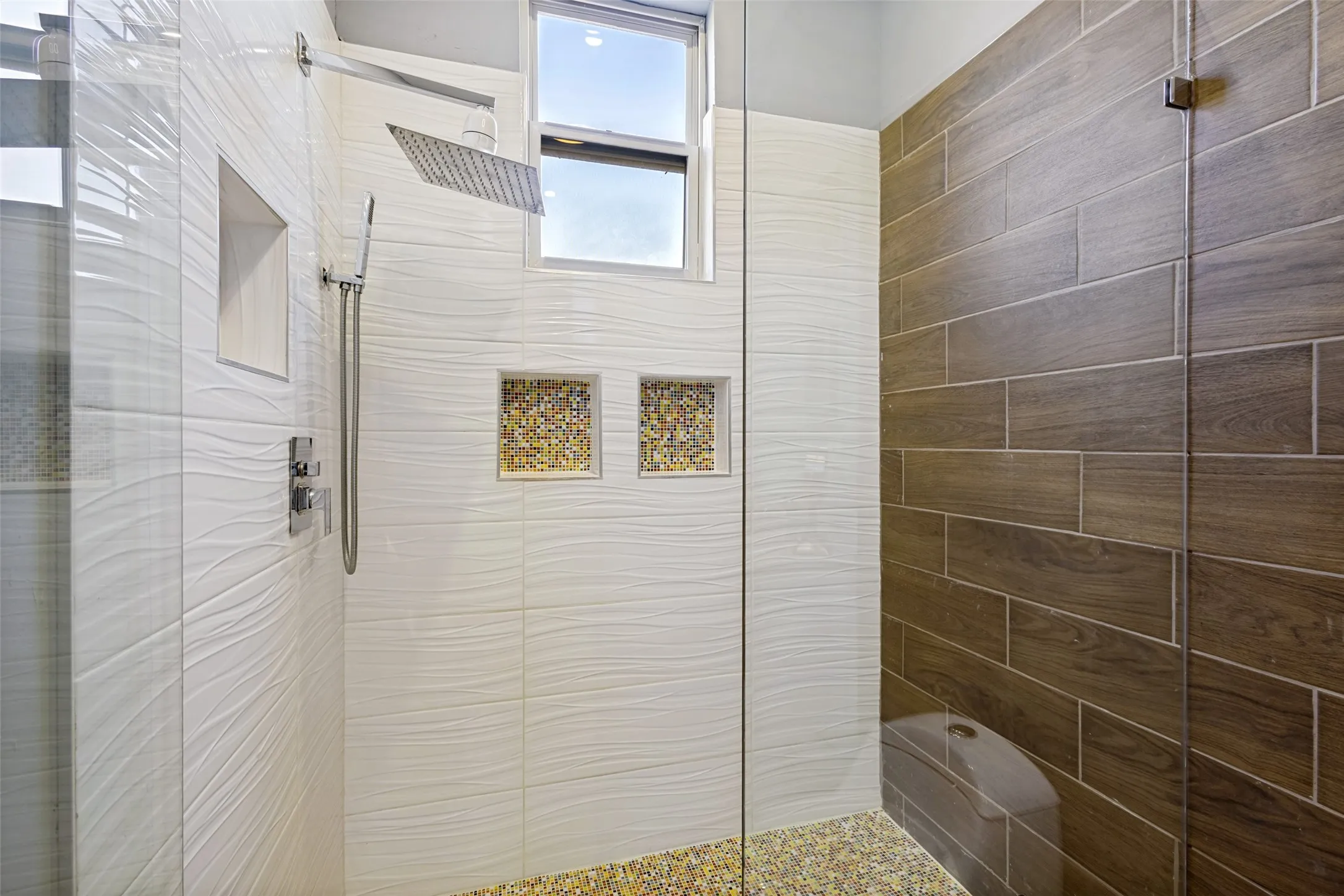 Both bathrooms have modern architecture showers with custom tile work and rain shower heads for a spa like feeling.