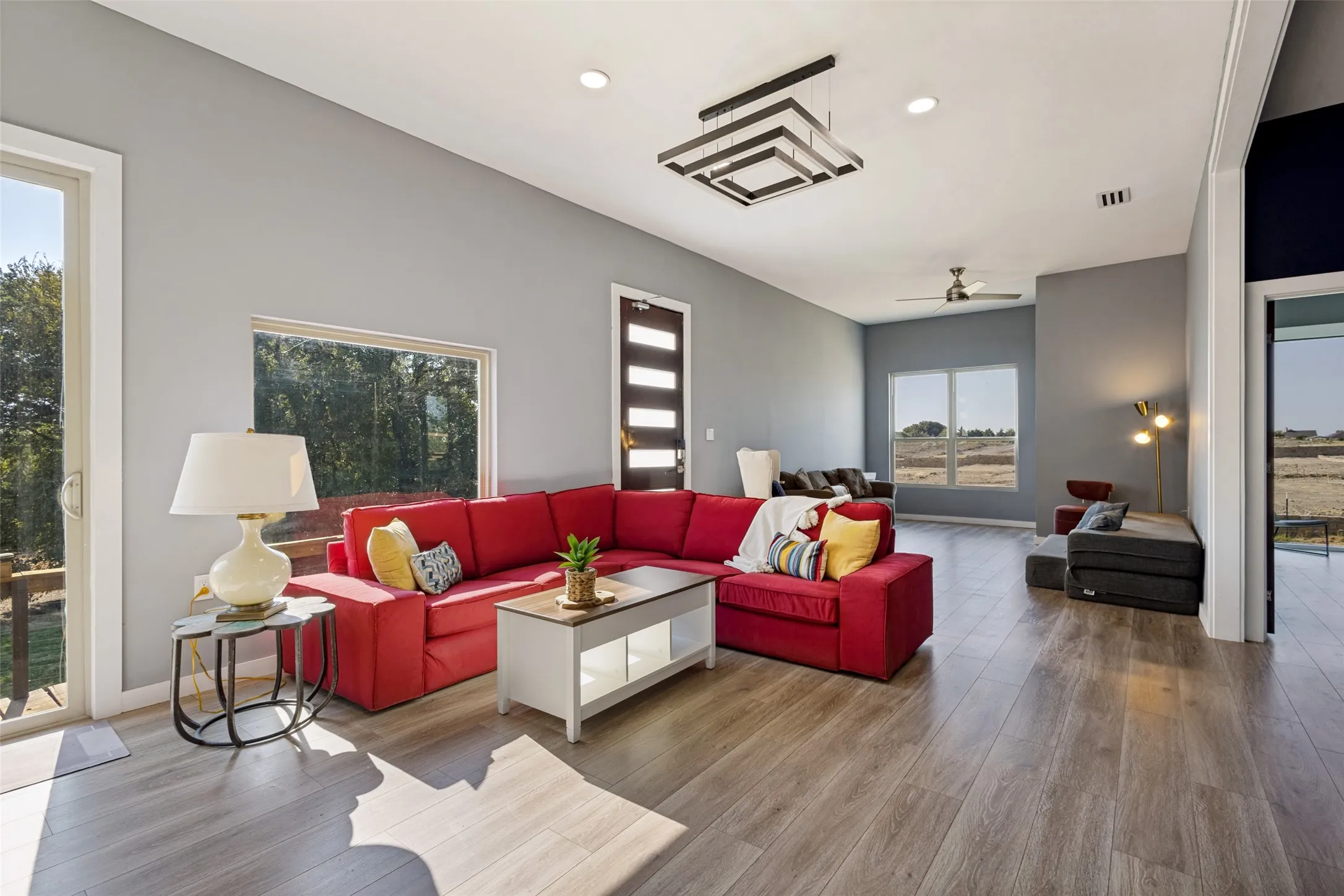 Luxury vinyl plank flooring throughout along with modern lighting.