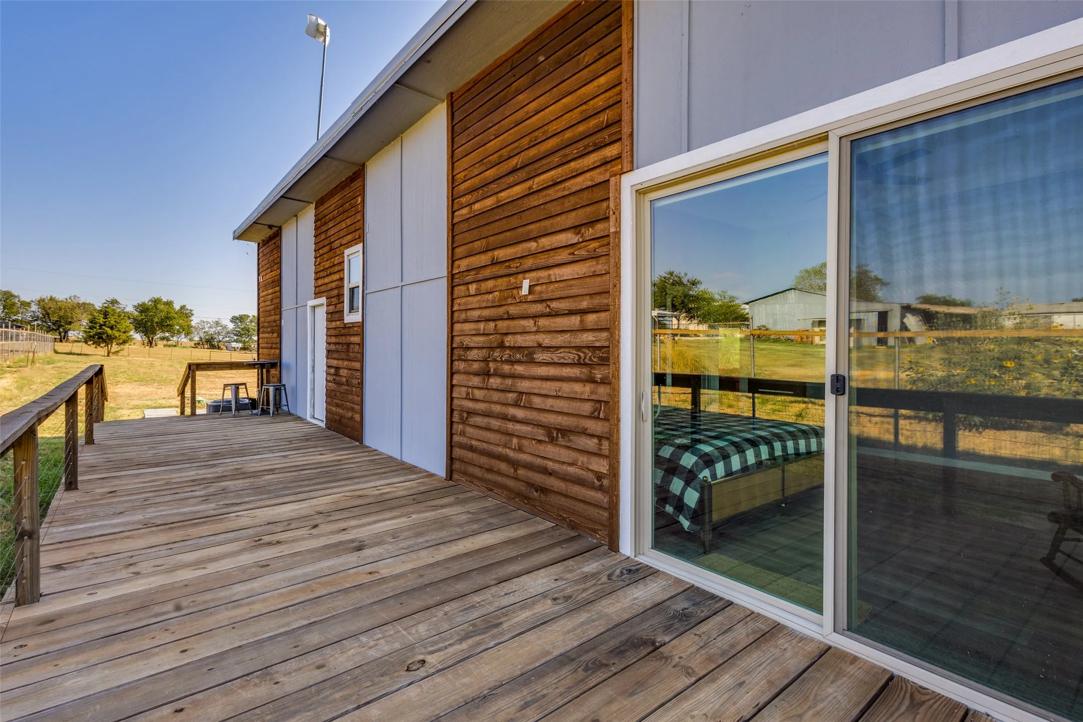 Another large deck at back of house with sliding door off master bedroom.