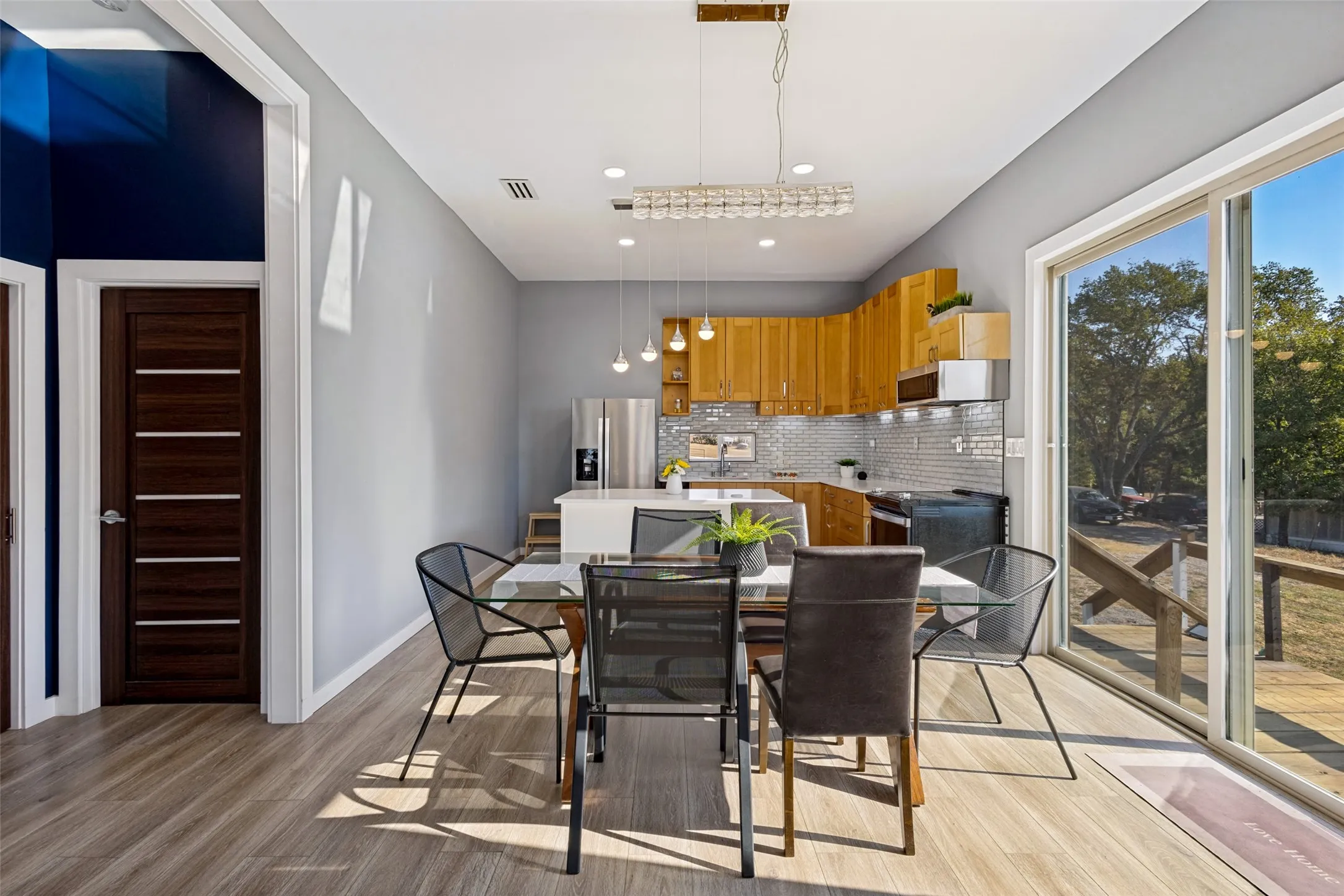 Dining room has sliding glass doors that open to the large deck which provides added space for enjoying the views and entertaining.