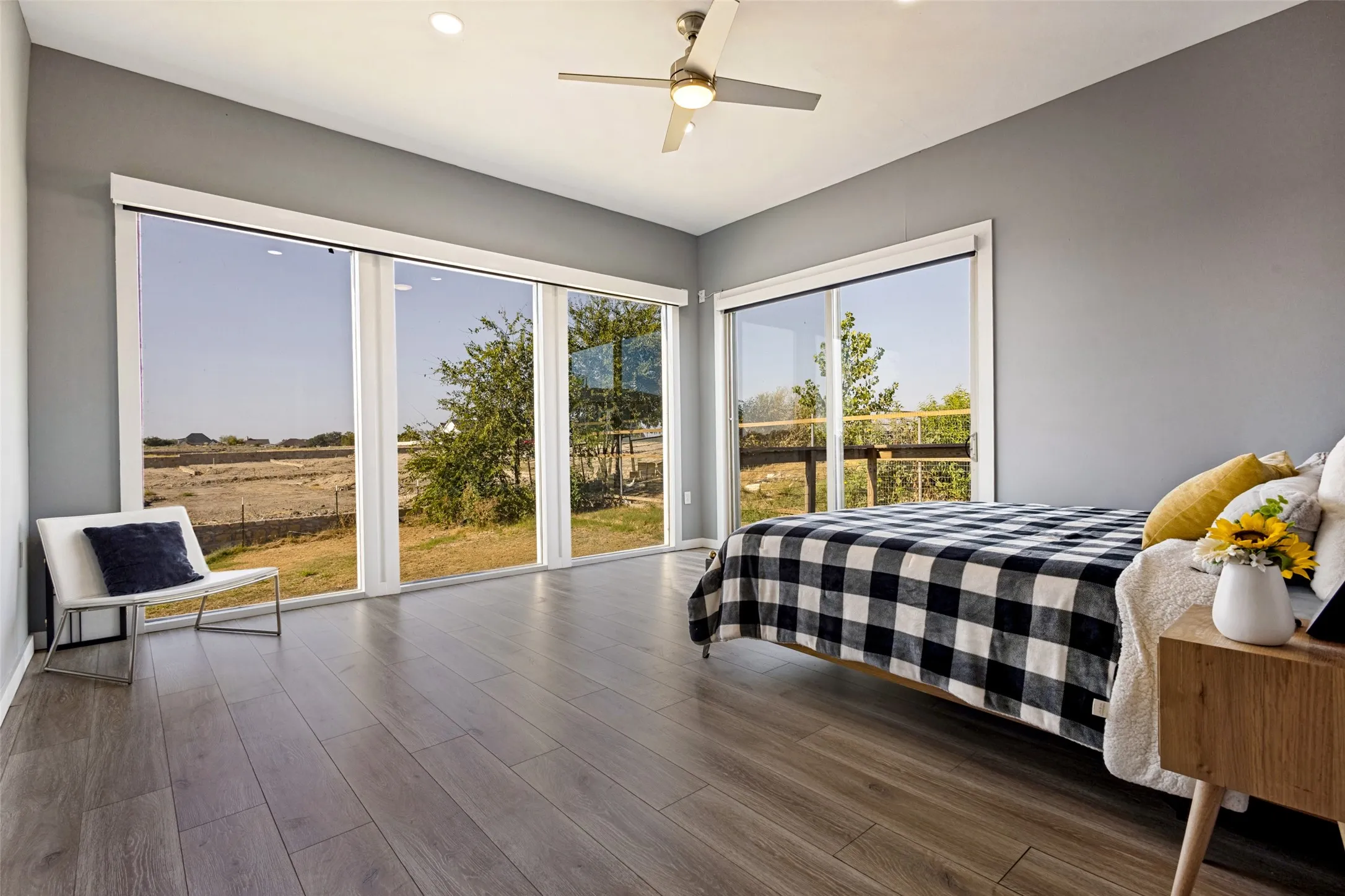 Master bedroom with an abundance of natural light and sliding door to back deck.