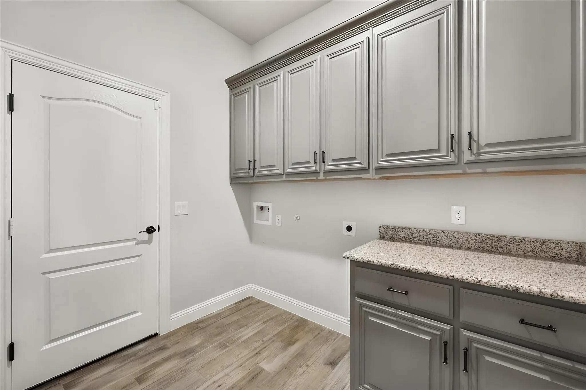 Large laundry room off the third bay garage