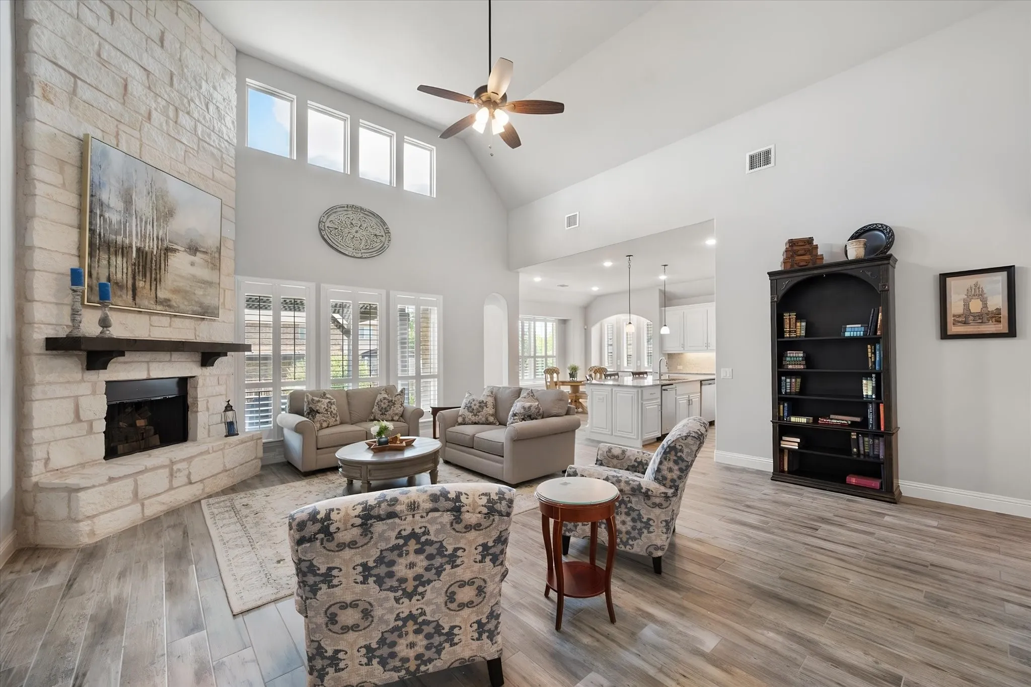 Corner fireplace with floor to ceiling stone accents
