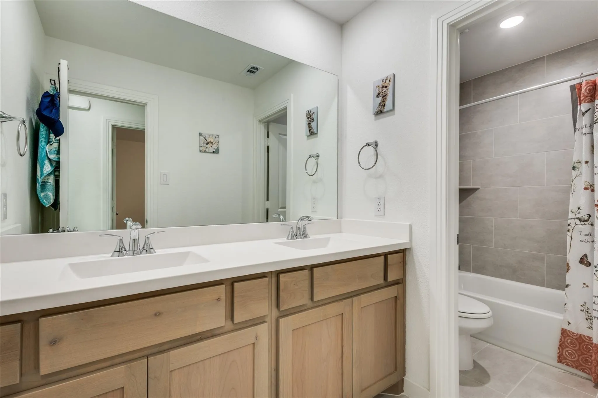 Dual vanity with rectangular undermount sinks and chrome fixtures