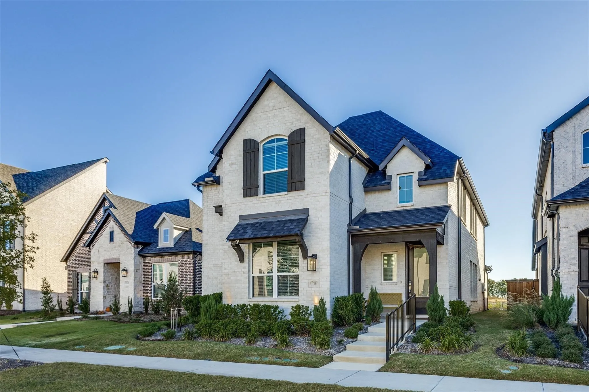 White brick exterior with dark trim accents