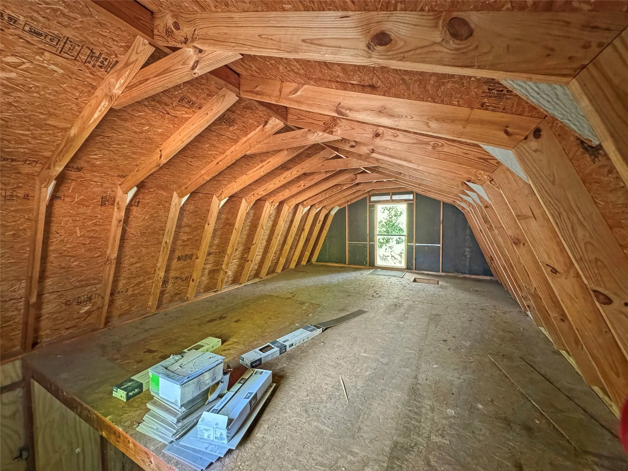 Barn/Workshop with Floored Loft Storage, Exposed wood framing with an arched ceiling structure