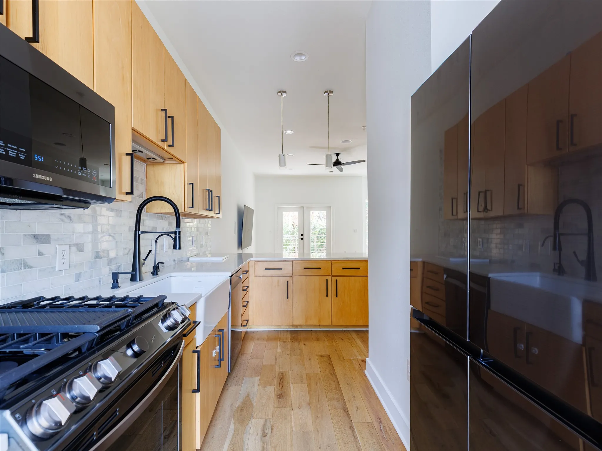 Marble countertops provide generous workspace while adding a timeless natural finish.