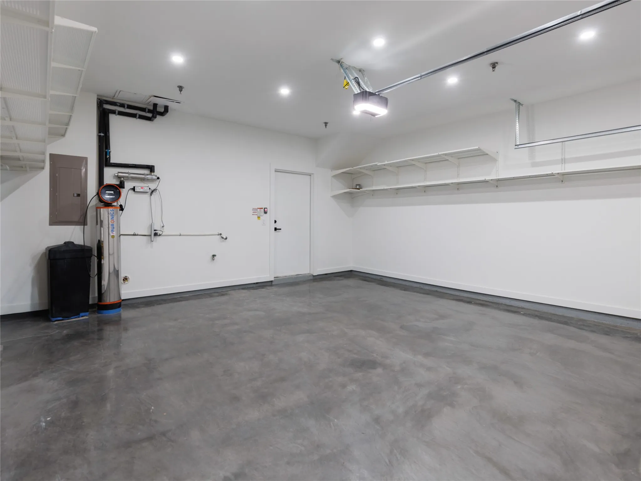 Fully finished out garage with can lights.