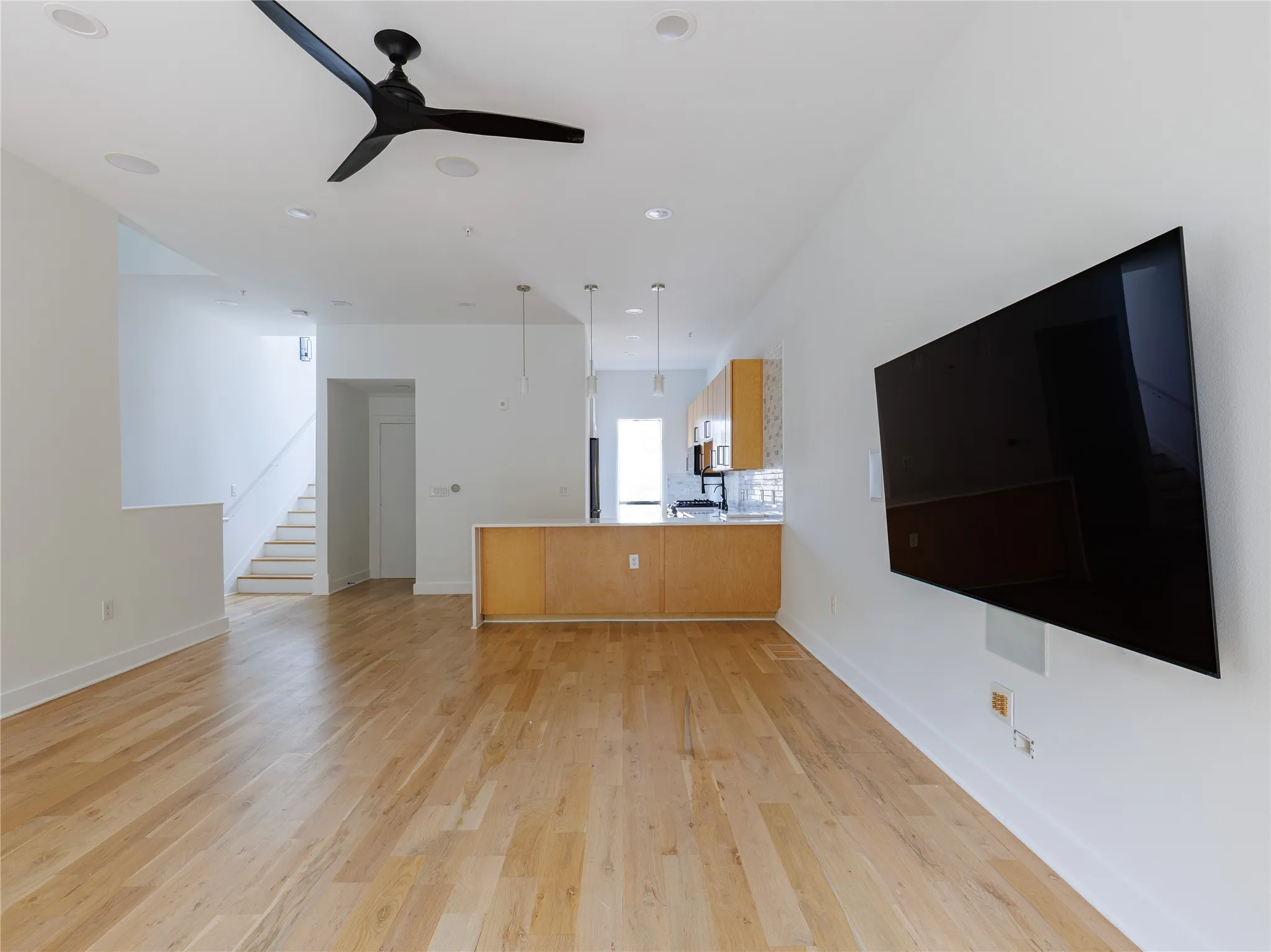 Light-filled living and kitchen area designed for comfortable everyday living and entertaining.