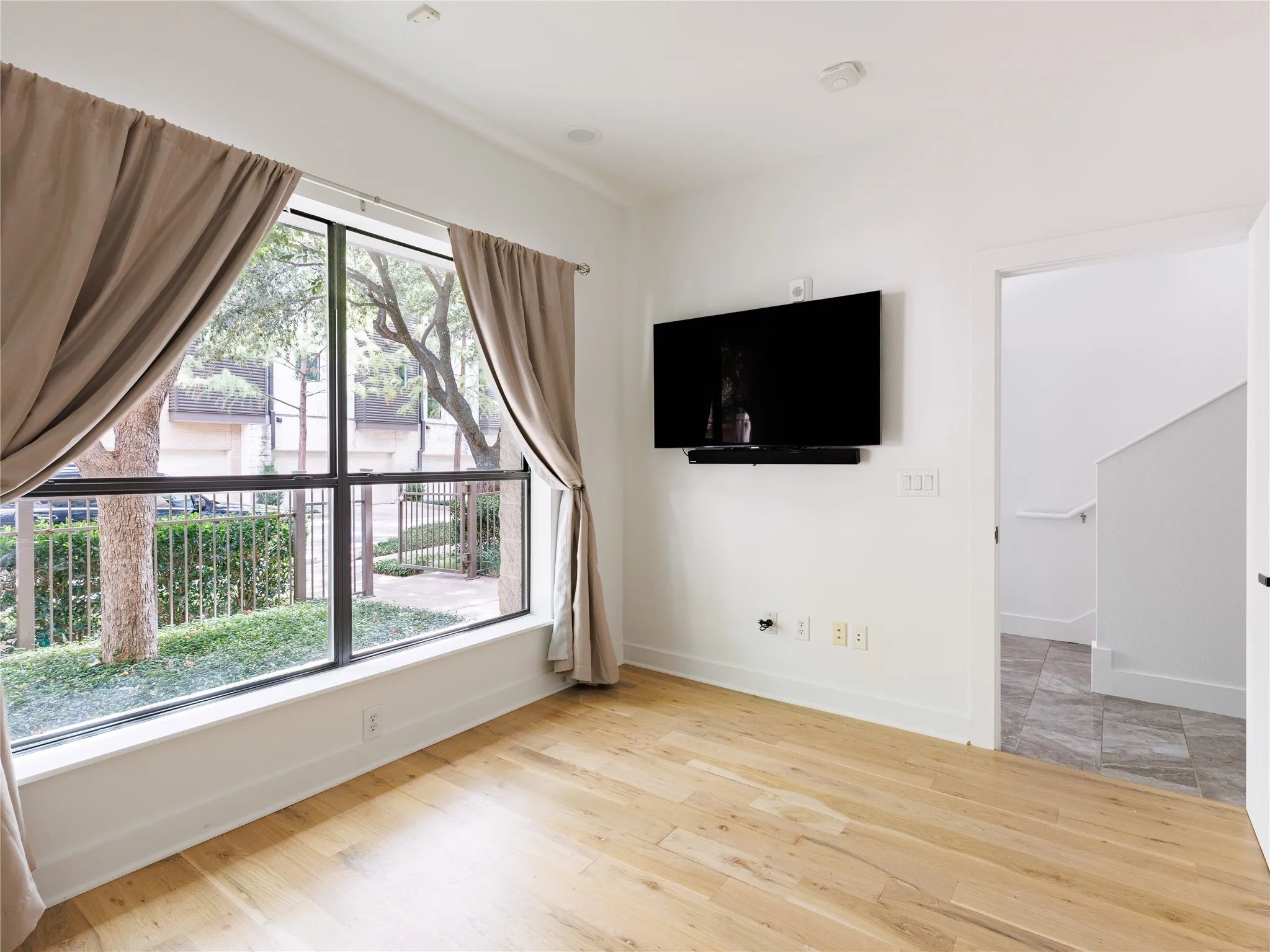First-floor secondary bedroom offers privacy and convenient separation from the home’s main living areas.