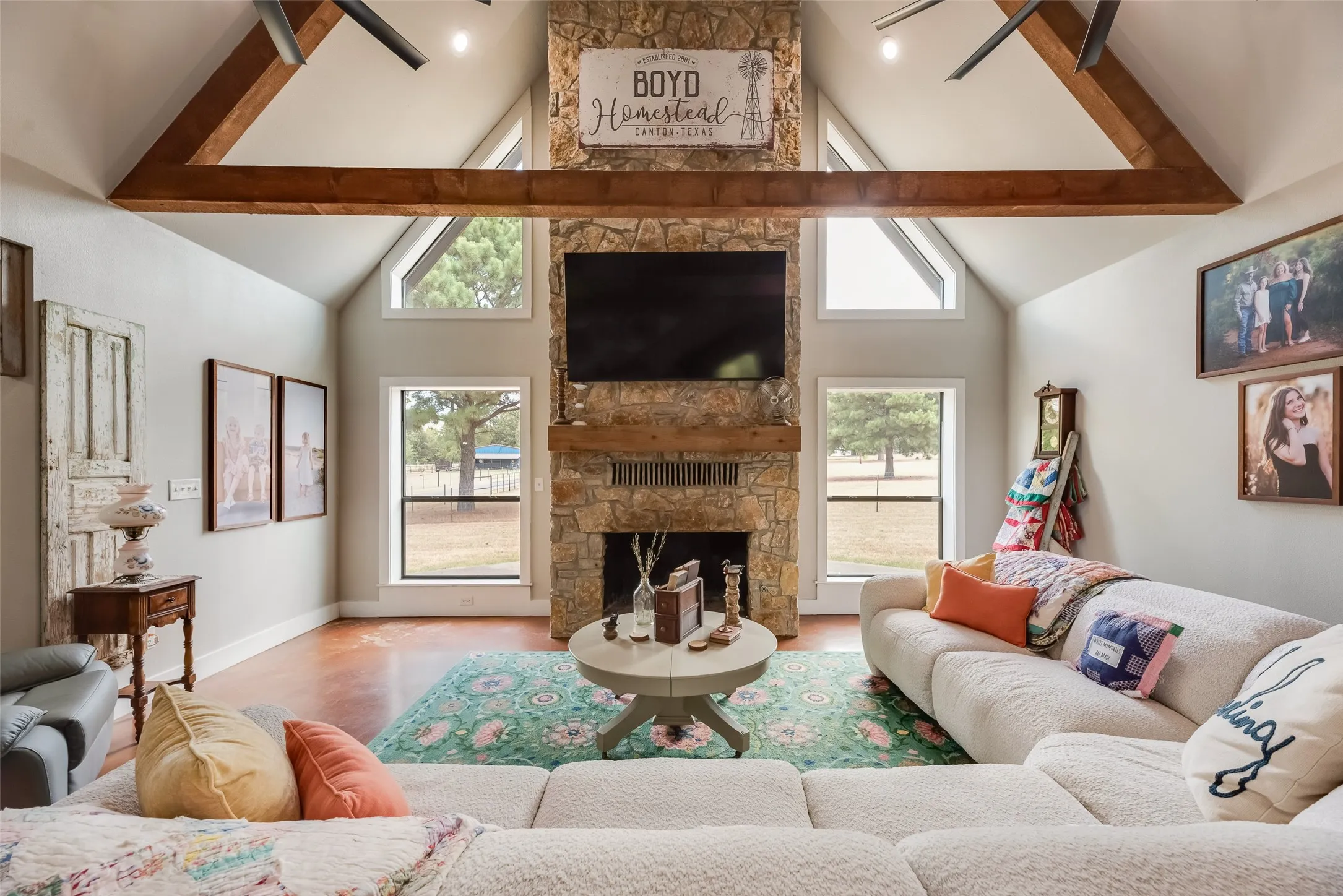 Living room with wood burning rock fireplace